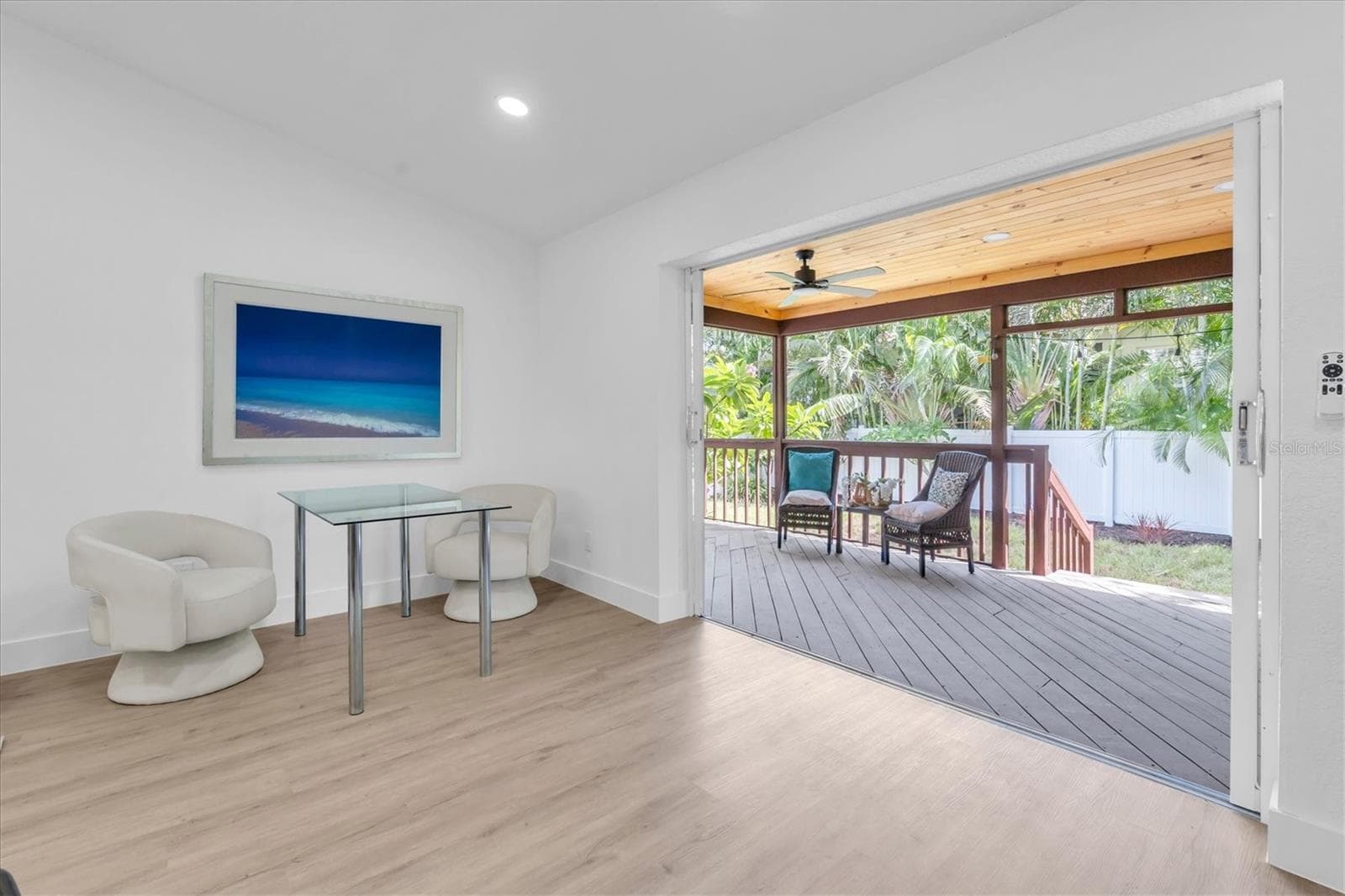 Four sets of sliding glass doors connect the home to the tropical backyard and covered lanai. - 630 PINTA DR, TIERRA VERDE
