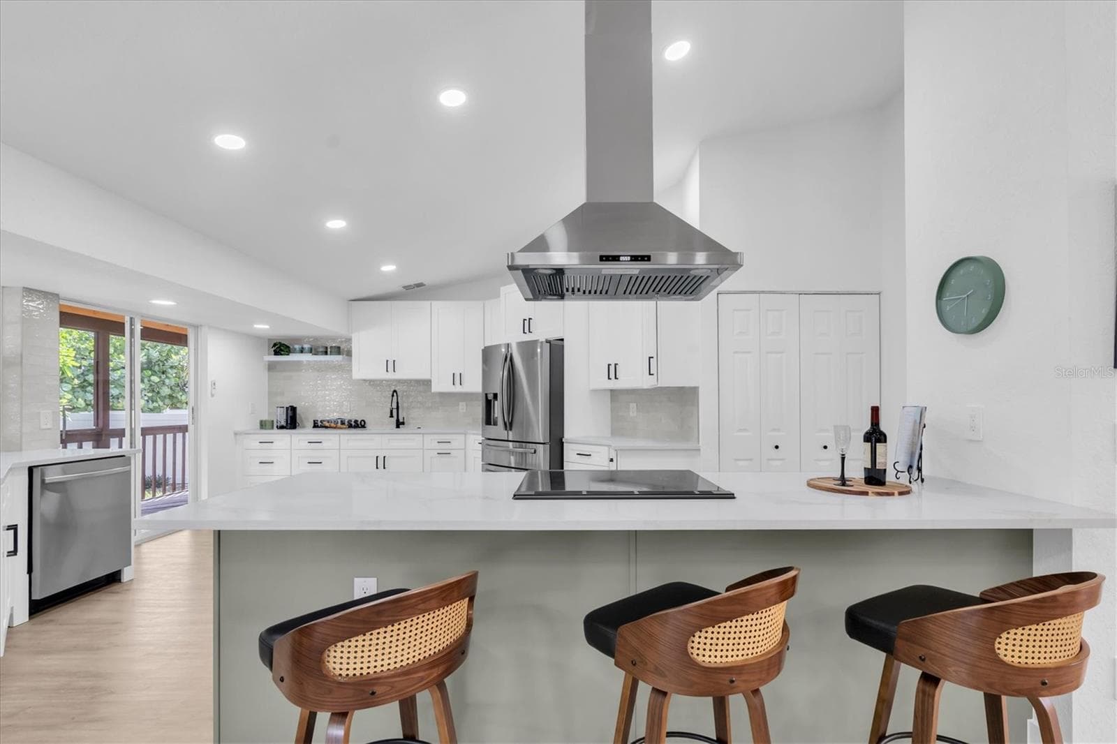 Oversized statement island offers exceptional space for gathering, dining and entertaining. - 630 PINTA DR, TIERRA VERDE