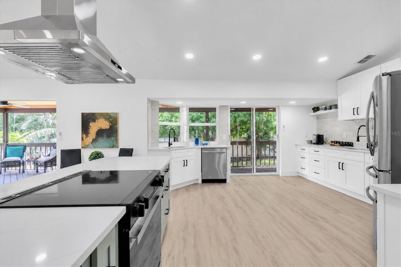 Stunning NEW kitchen with quartz surfaces, custom cabinetry and stainless steel appliances. - 630 PINTA DR, TIERRA VERDE