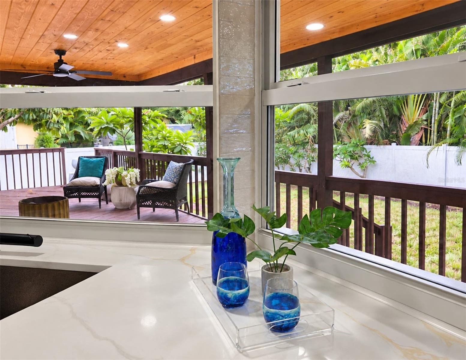 Kitchen pass-through window makes outdoor dining and entertaining effortless. - 630 PINTA DR, TIERRA VERDE