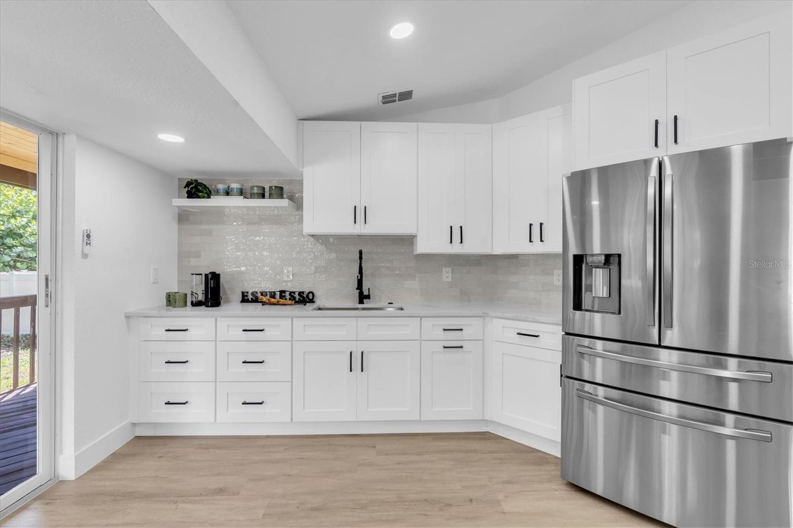 Two generous sinks—including a dedicated prep sink—plus two pantries provide outstanding functionality. - 630 PINTA DR, TIERRA VERDE
