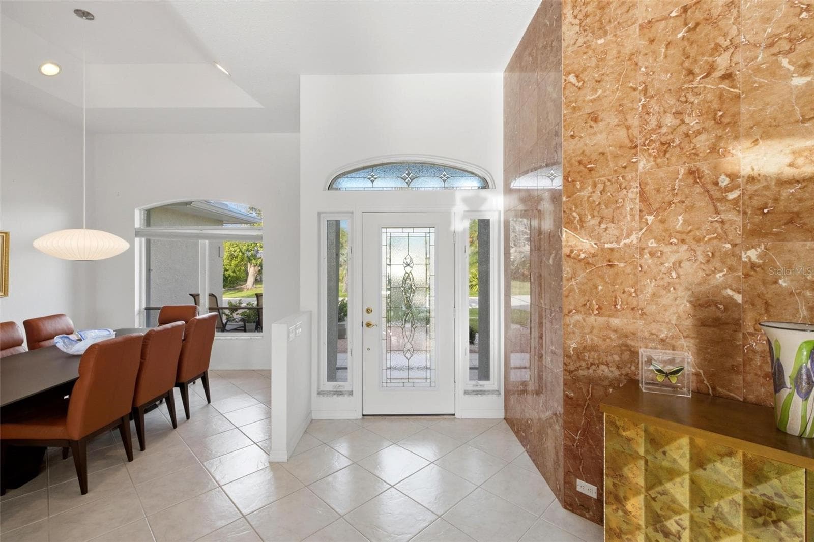 Glass entry door with transom and two side windows brings so much light into the entry - 209 DIVINCI DR, PUNTA GORDA