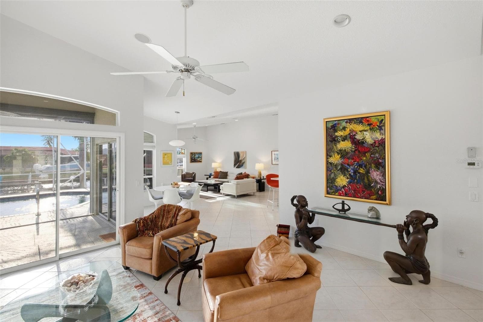 Nearly every room has a slider leading to the lanai and pool. - 209 DIVINCI DR, PUNTA GORDA