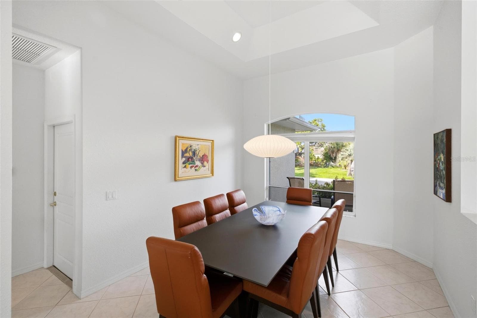 large dining room easily seats 8 with room to spare. - 209 DIVINCI DR, PUNTA GORDA