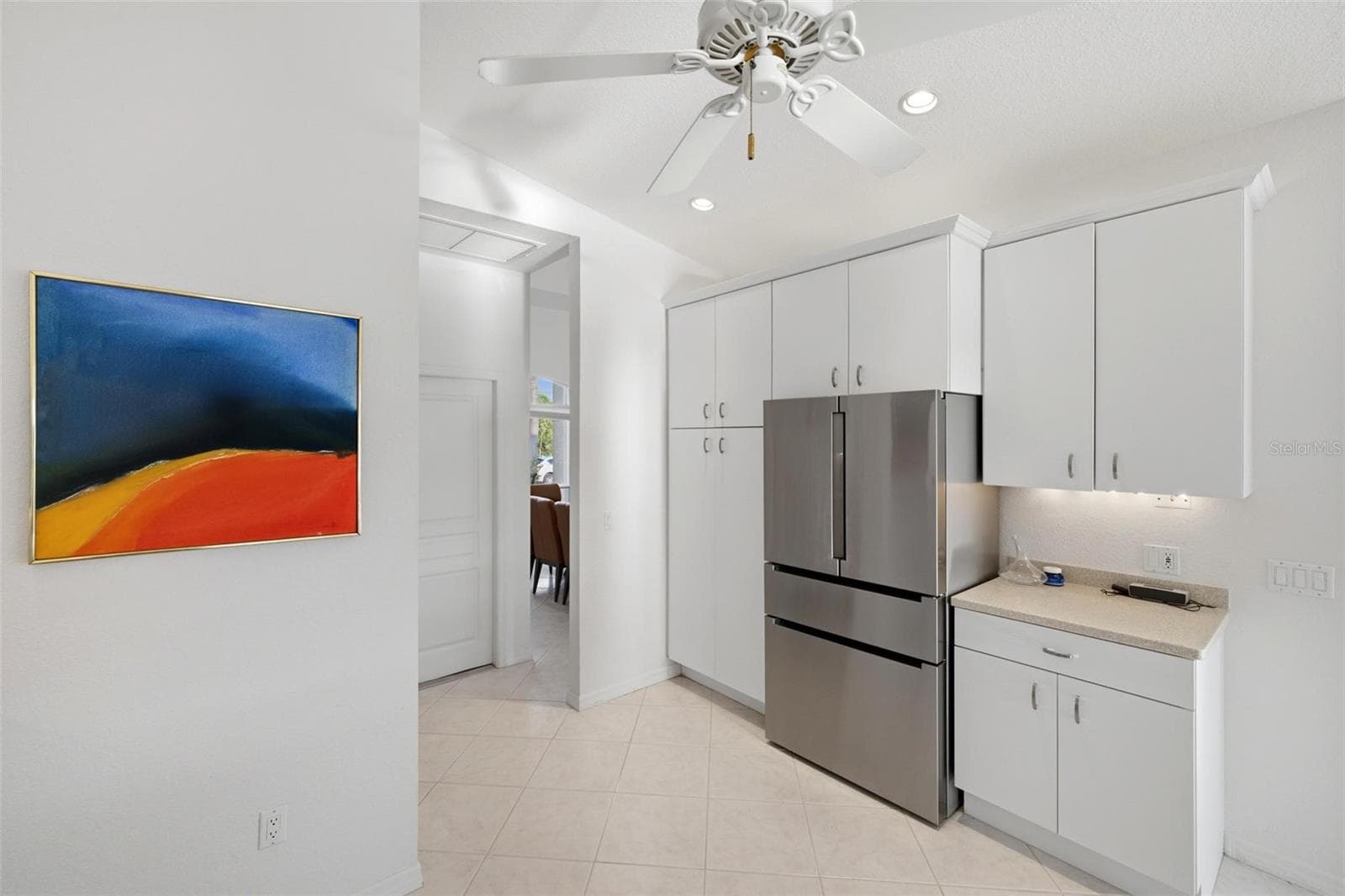 pantry style cabinetry provides abundant storage for all of those large appliances - 209 DIVINCI DR, PUNTA GORDA