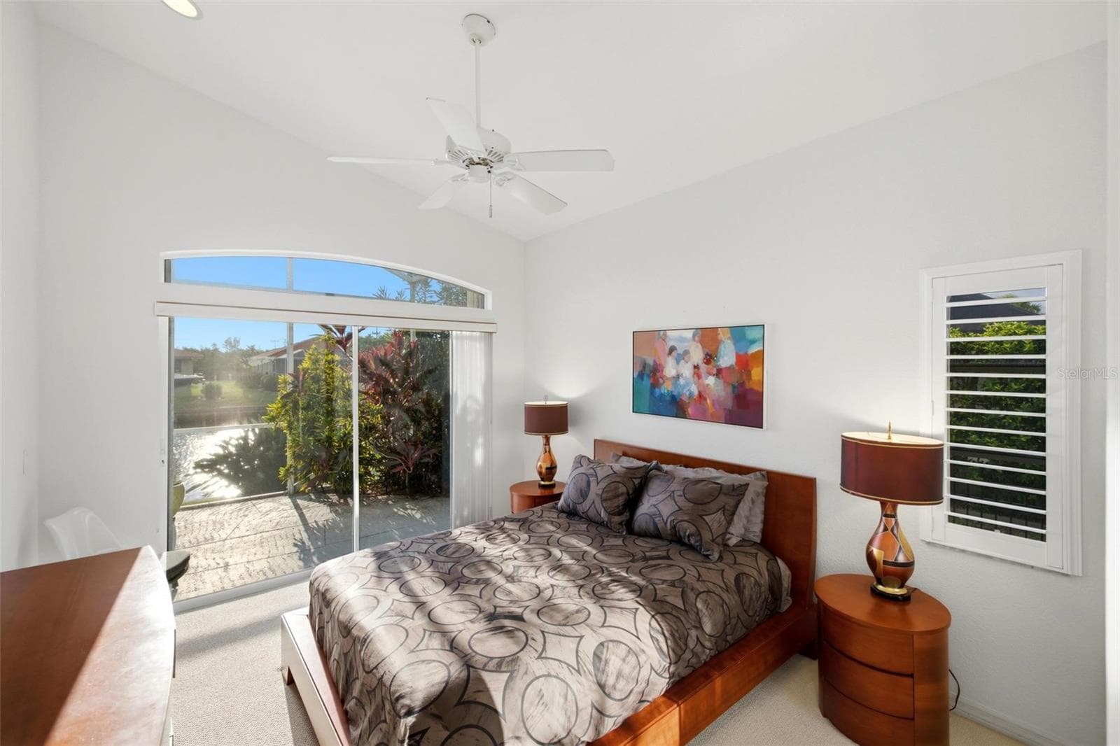 Guest bedroom has a slider to the lanai. - 209 DIVINCI DR, PUNTA GORDA
