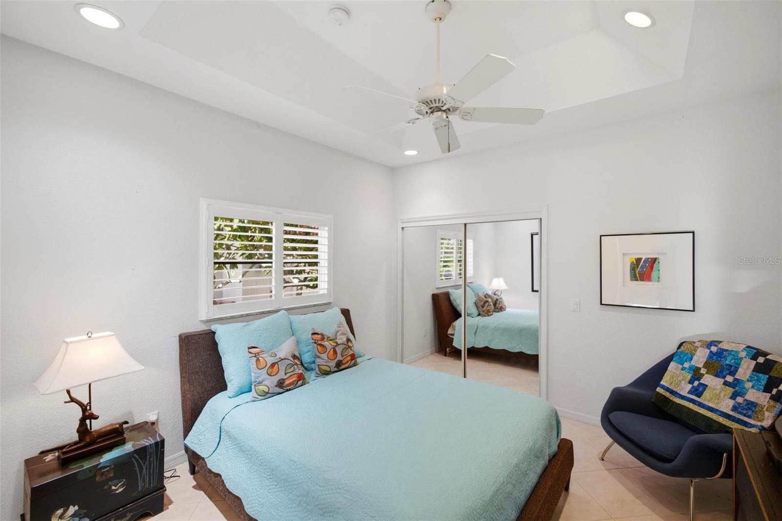 Guest bedroom has a tray ceiling and spacious closet. - 209 DIVINCI DR, PUNTA GORDA