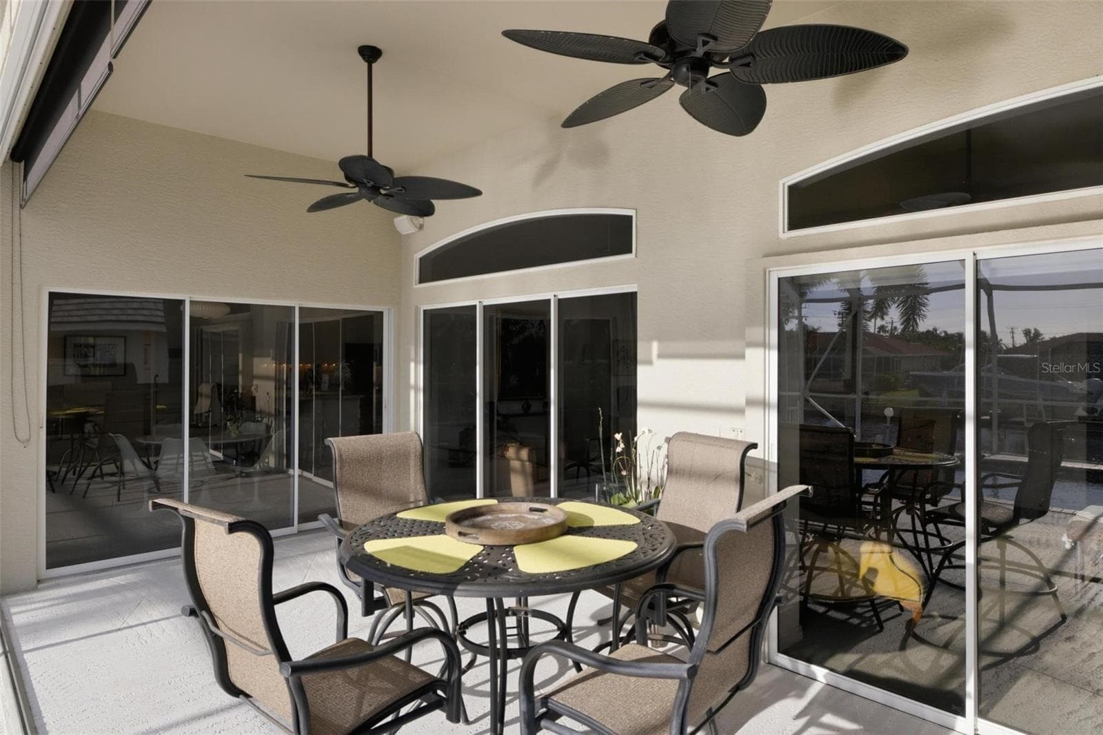 covered lanai space has an outdoor kitchen and room for furniture - 209 DIVINCI DR, PUNTA GORDA