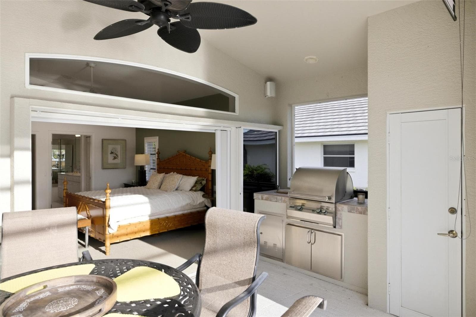 outdoor kitchen has a sink, grill and a storage closet. - 209 DIVINCI DR, PUNTA GORDA