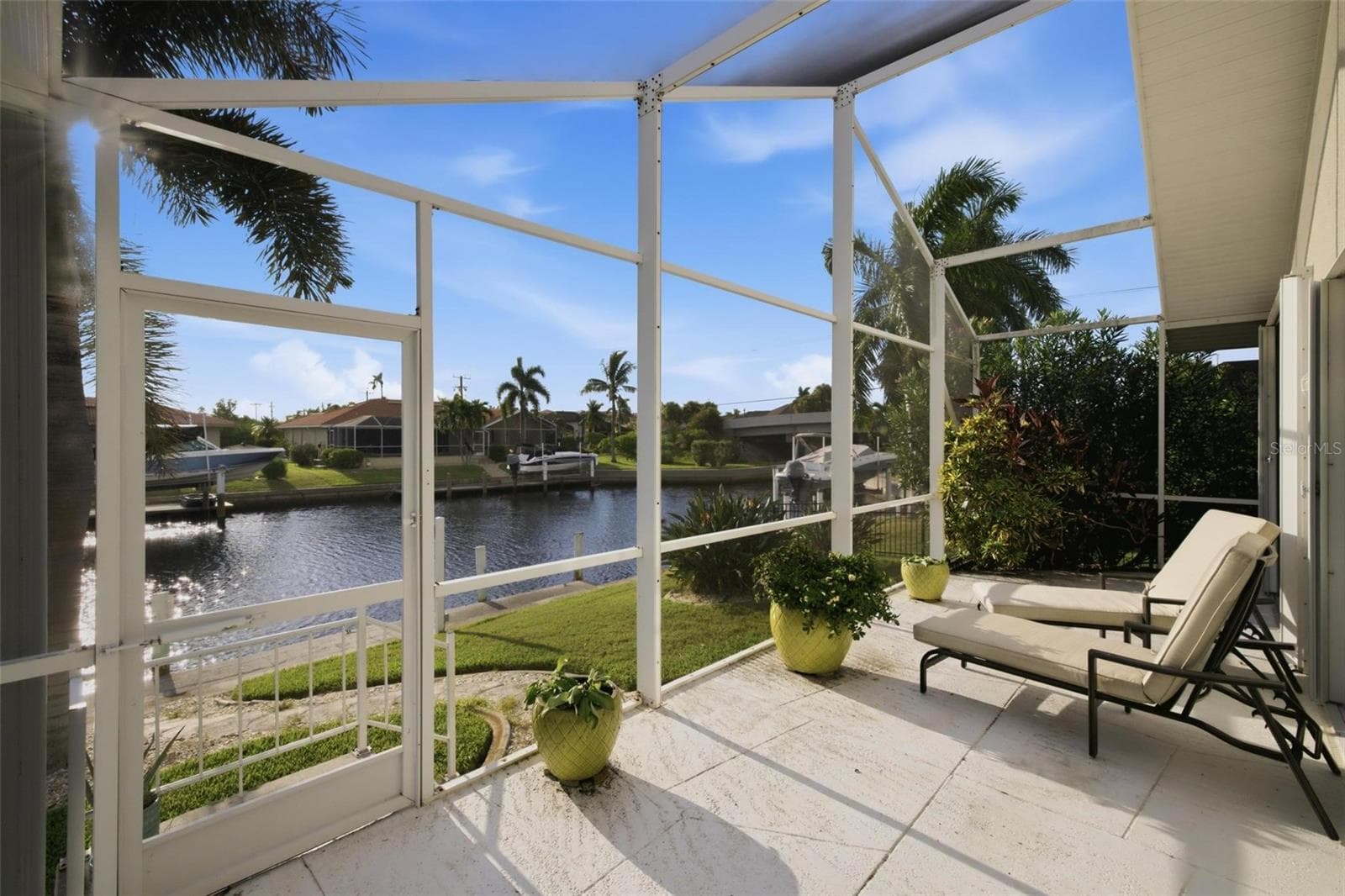 uncovered lanai area next to the guest bedroom is great for sunsets. - 209 DIVINCI DR, PUNTA GORDA