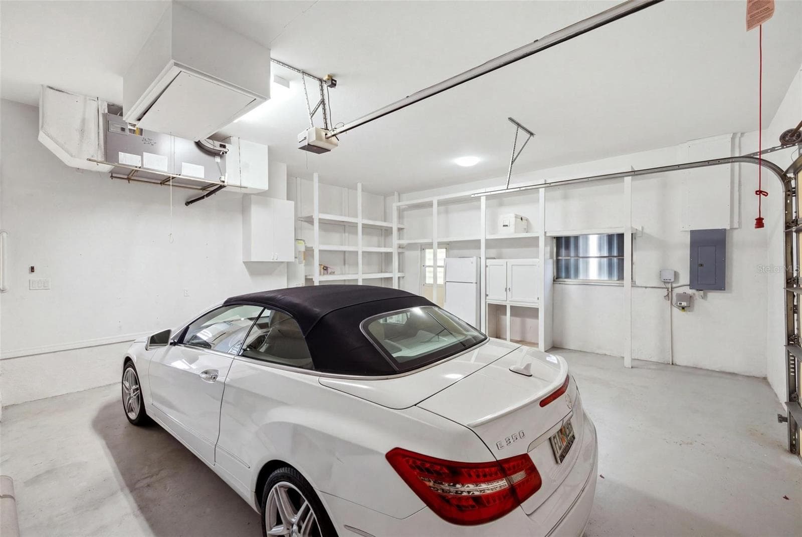 oversized garage measures 27x25 and has built in storage - 209 DIVINCI DR, PUNTA GORDA