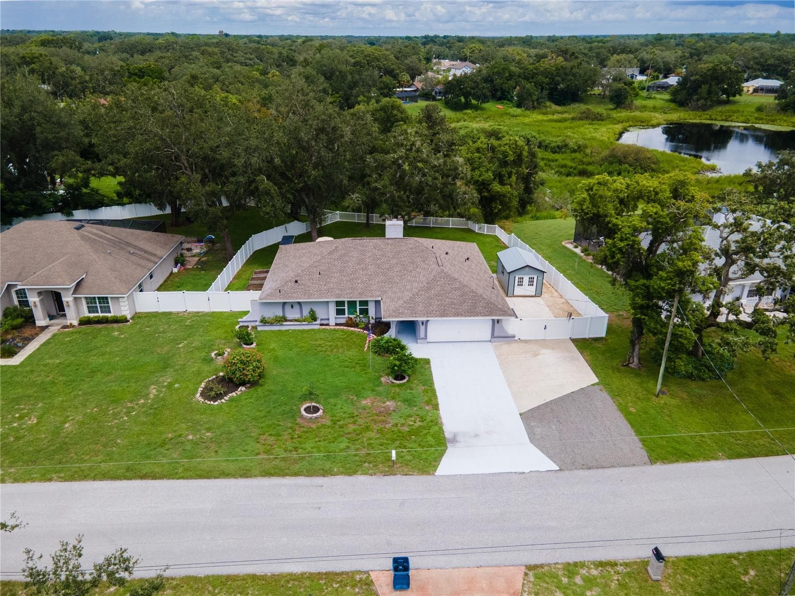 Oversized driveway, fully fenced and gated, overlooks peaceful and serence pond! - 8345 APPLE ORCHARD RD, SPRING HILL