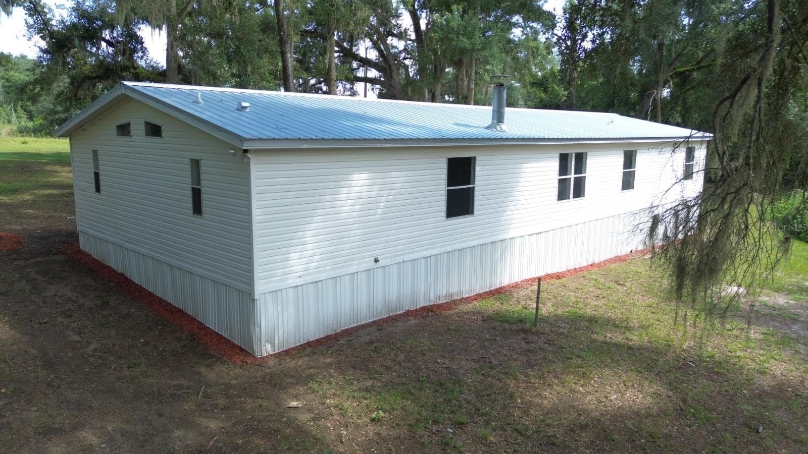 Manufactured Home at 3391 NW BUR OAK PL, JENNINGS, photo 4 of 34