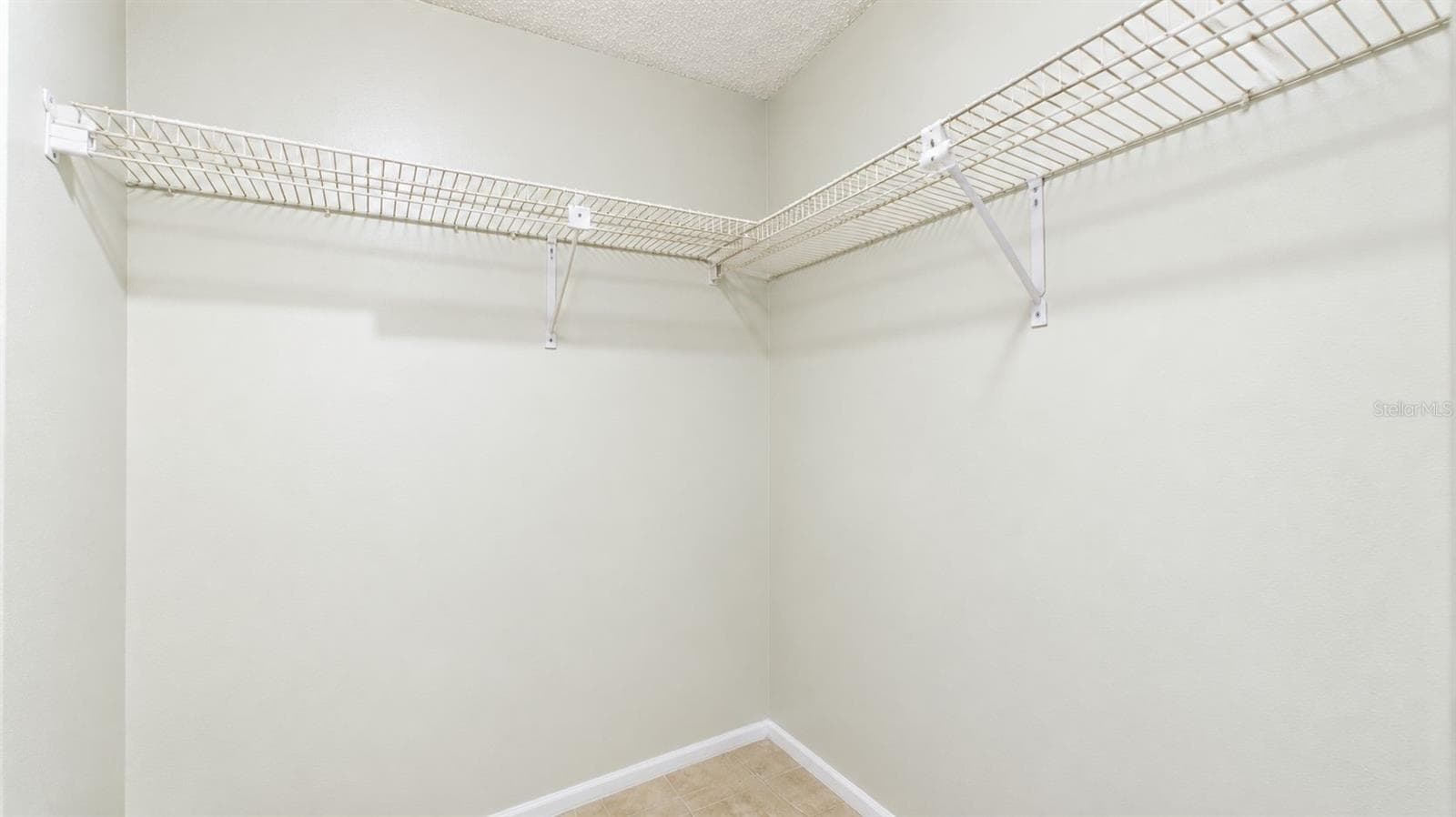 Primary bedroom walk-in closet - 8840 CARMEN LN, PORT RICHEY