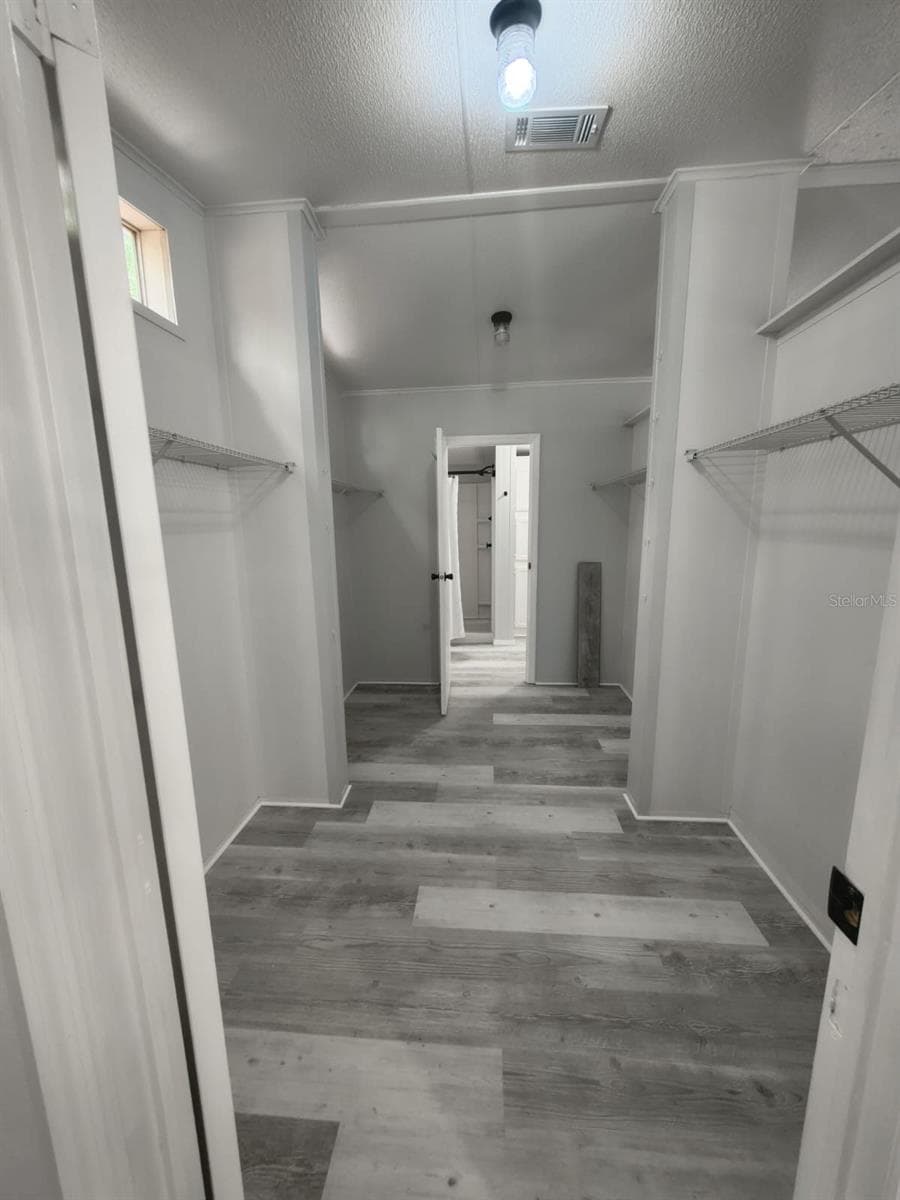 Primary walk-in closet - 3391 NW BUR OAK PL, JENNINGS