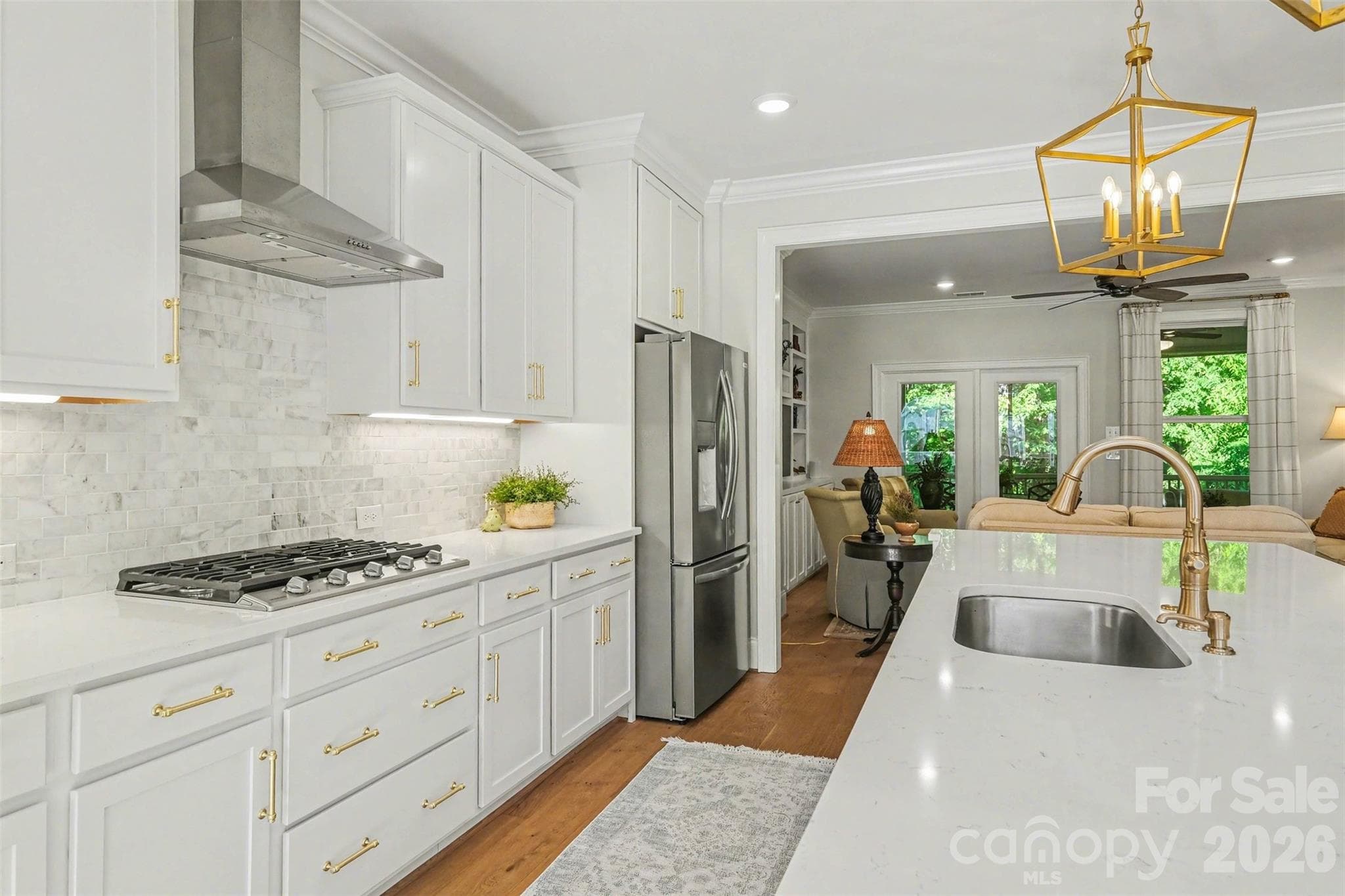 The kitchen view into the living room. Natural light and a nice outside view, too! - 3743 Keyworth Way, Indian Land
