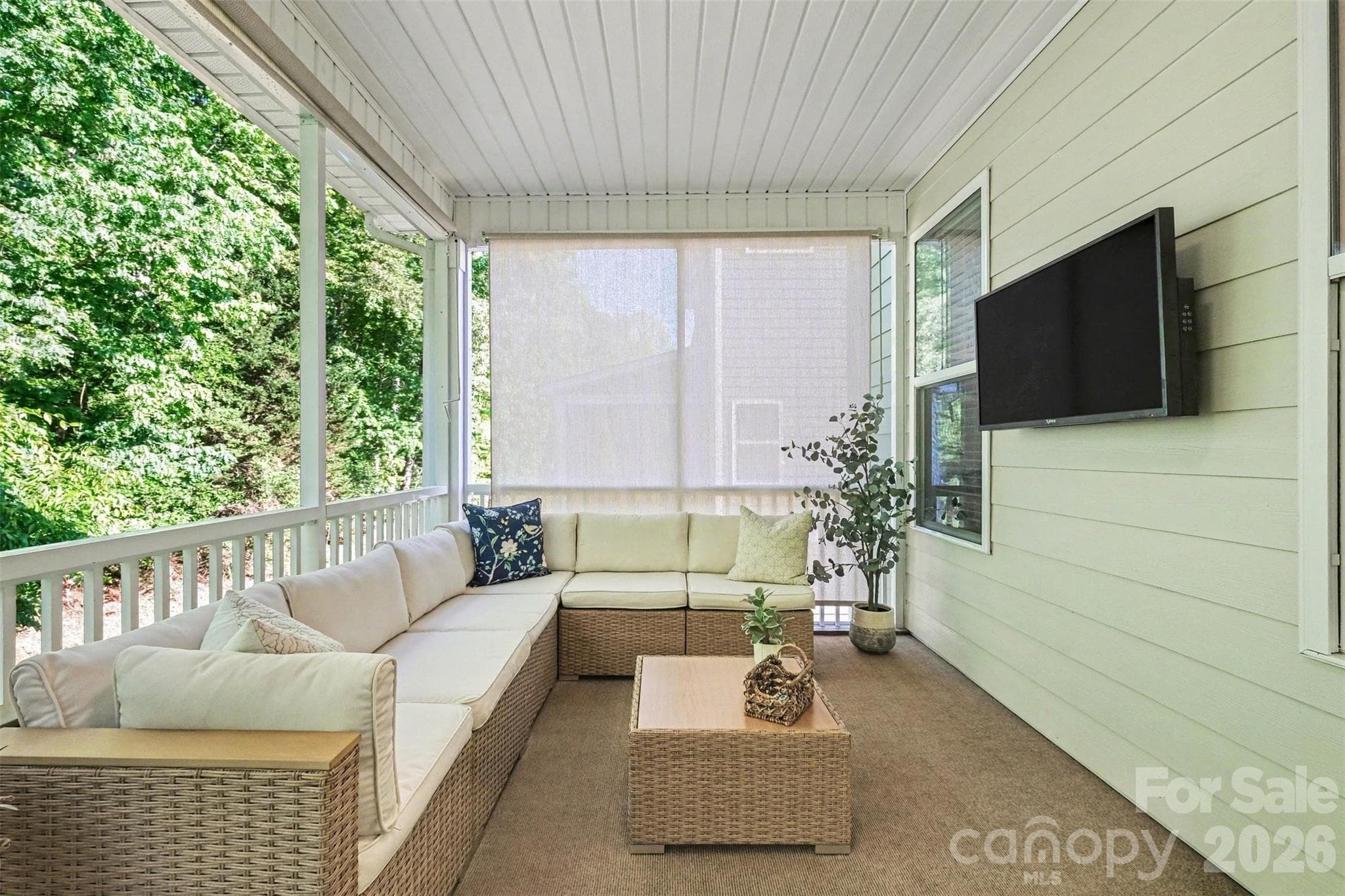 The spacious screened-in porch can accomodate furniture and has a great spot for the television! - 3743 Keyworth Way, Indian Land