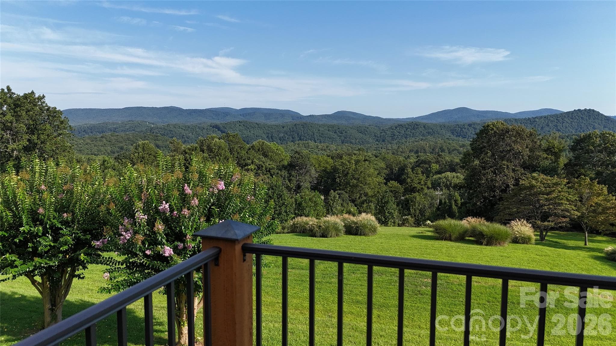 Wow! Rare and amazing mountain views right off your covered back porch or soak up the sun or play in the rain on the uncovered section! LOL - 93 Orchard Hill, Saluda