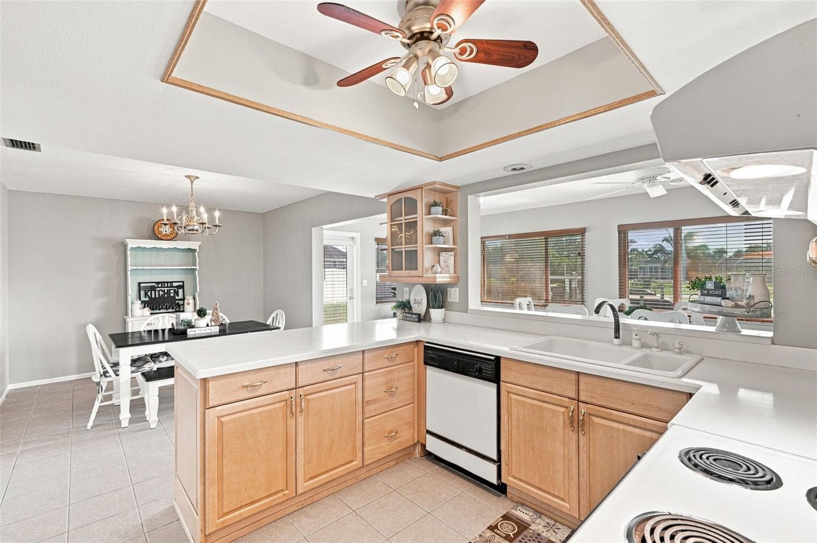 Bright Kitchen with Tray Ceiling and Abundant Counter Space - 155 MORGAN LN SE, PORT CHARLOTTE
