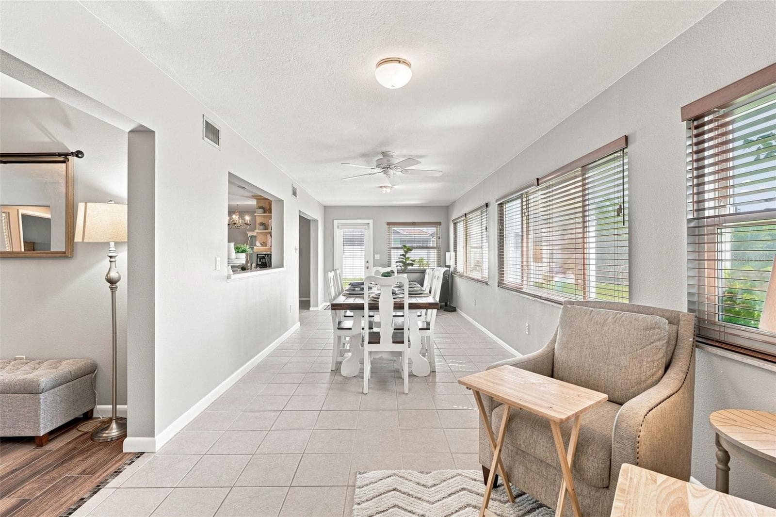 Spacious Florida Room with Pass Through Overlooking the Kitchen - 155 MORGAN LN SE, PORT CHARLOTTE