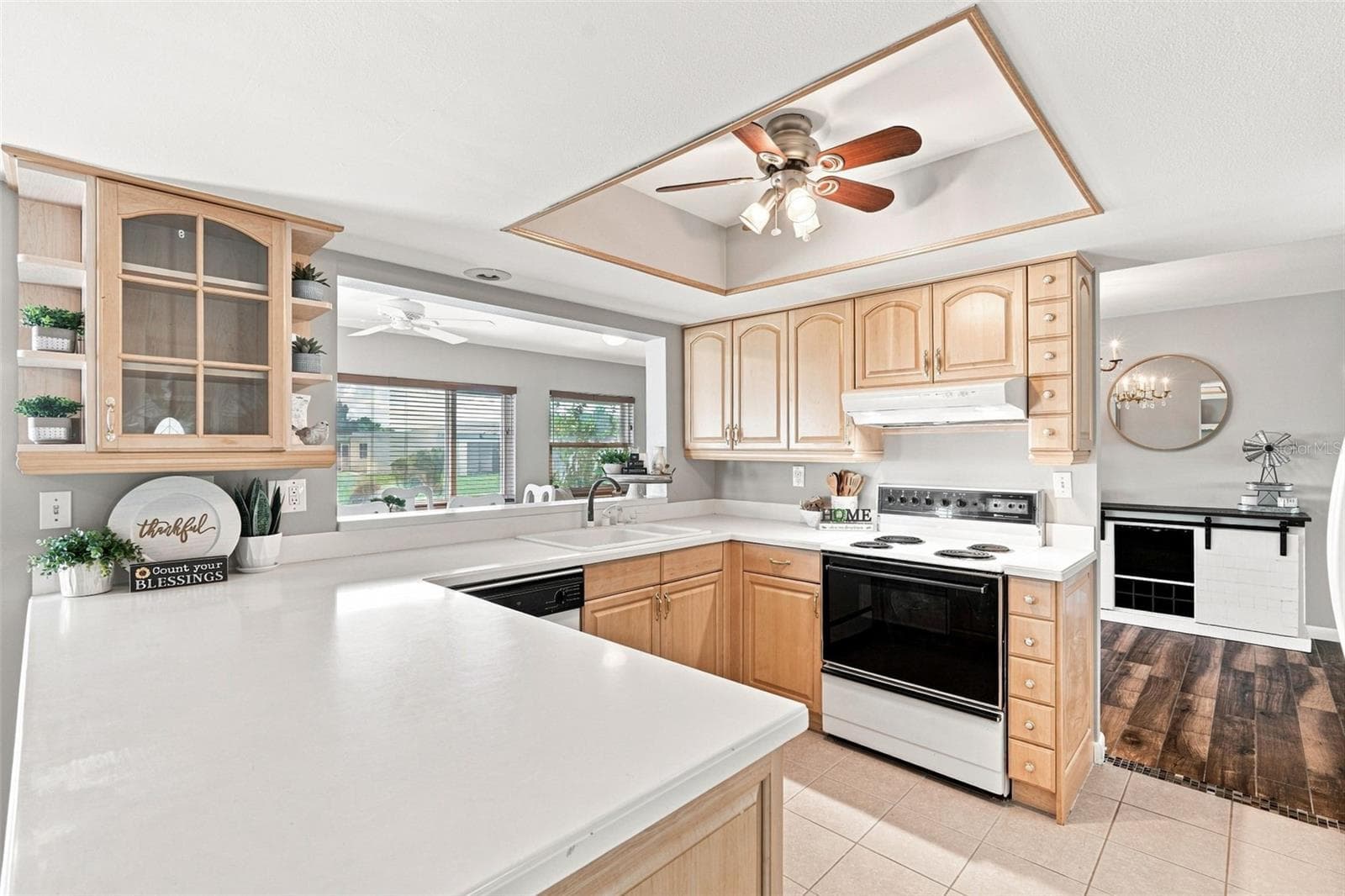 Open Kitchen Overlooking the Florida Room - 155 MORGAN LN SE, PORT CHARLOTTE