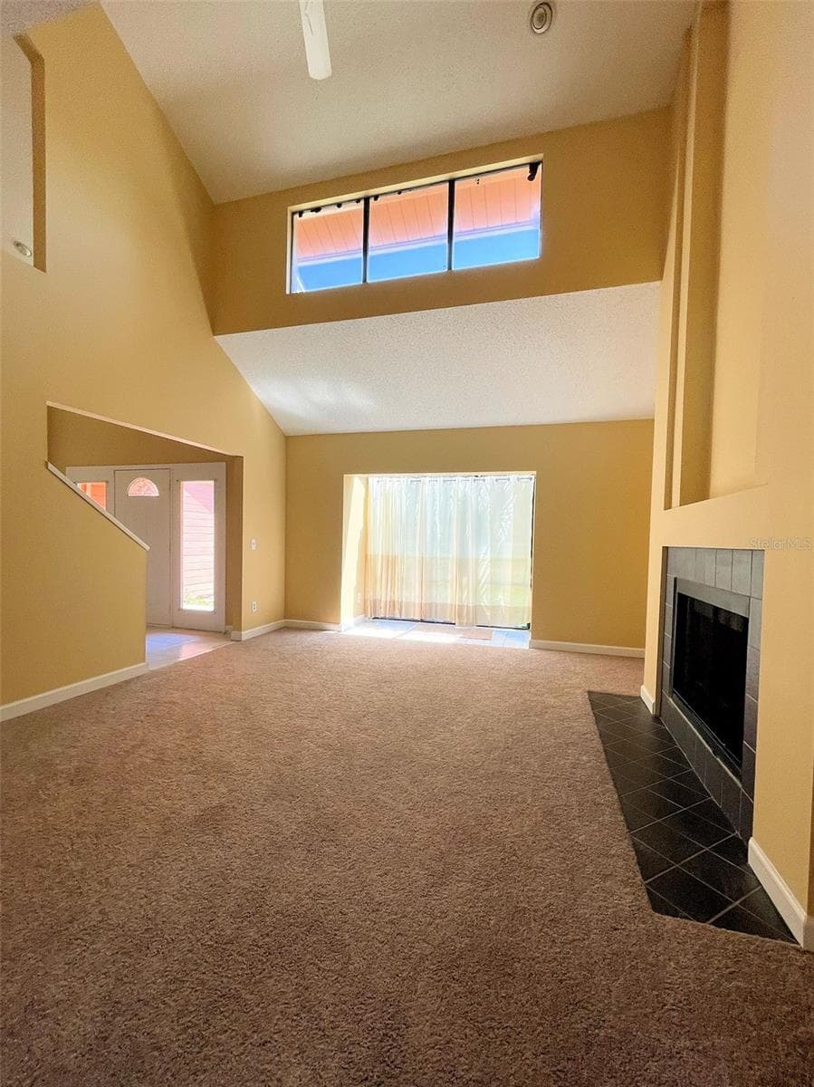Living Room with 2 story ceilings and fireplace - 4431 REAL CT, ORLANDO