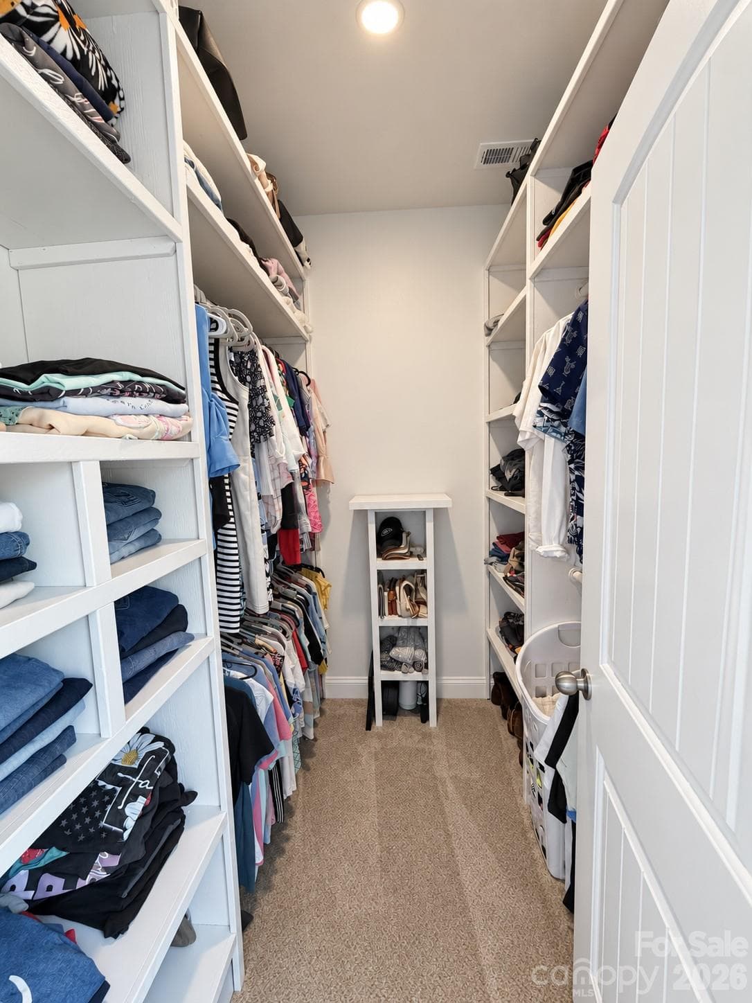 Primary walk in closet with new custom shelving - 9201 Providence Road S, Waxhaw
