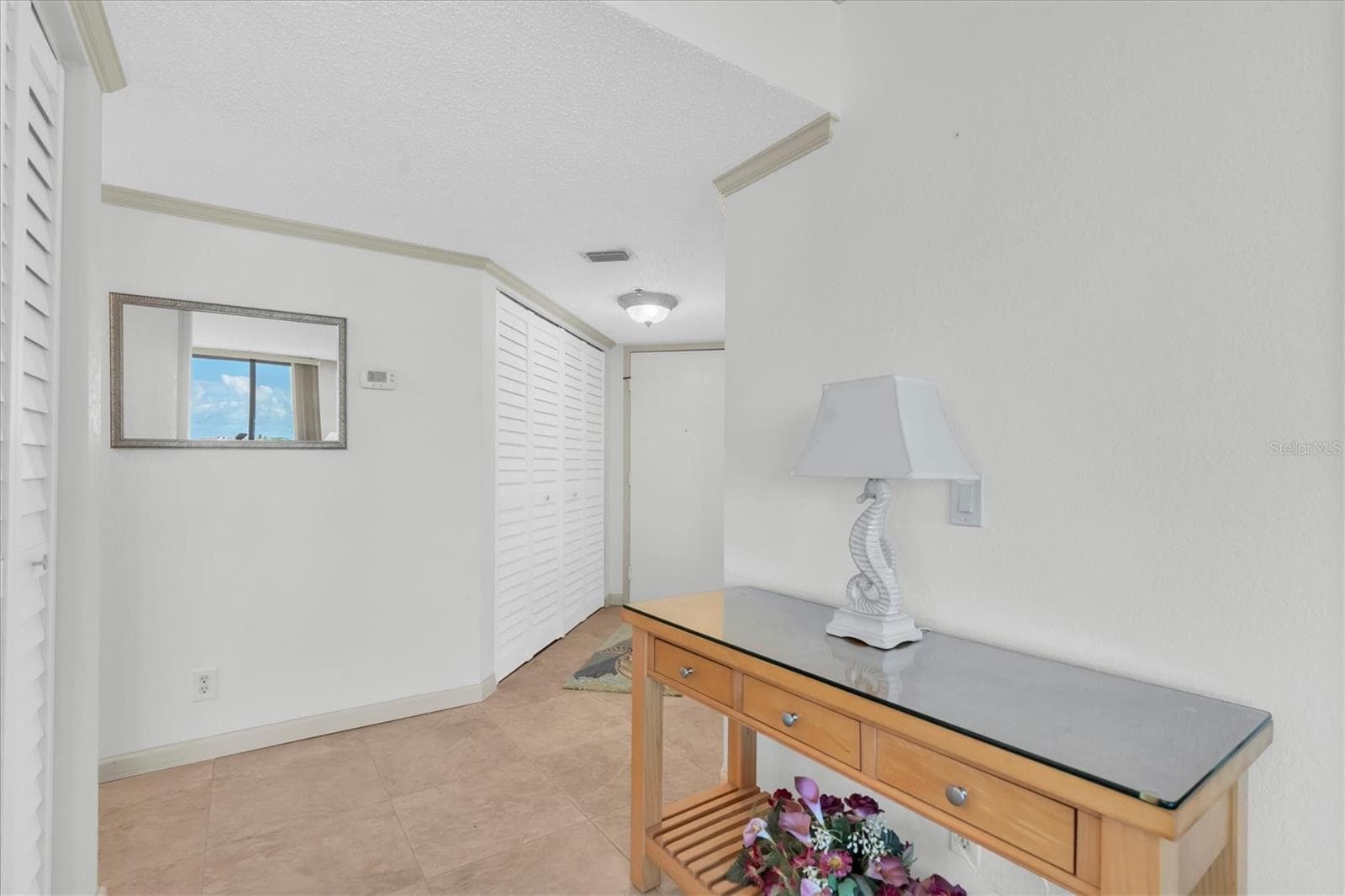 Inviting interior hallway splits off living space and guest bedroom - 6287 BAHIA DEL MAR CIR #602, ST PETERSBURG