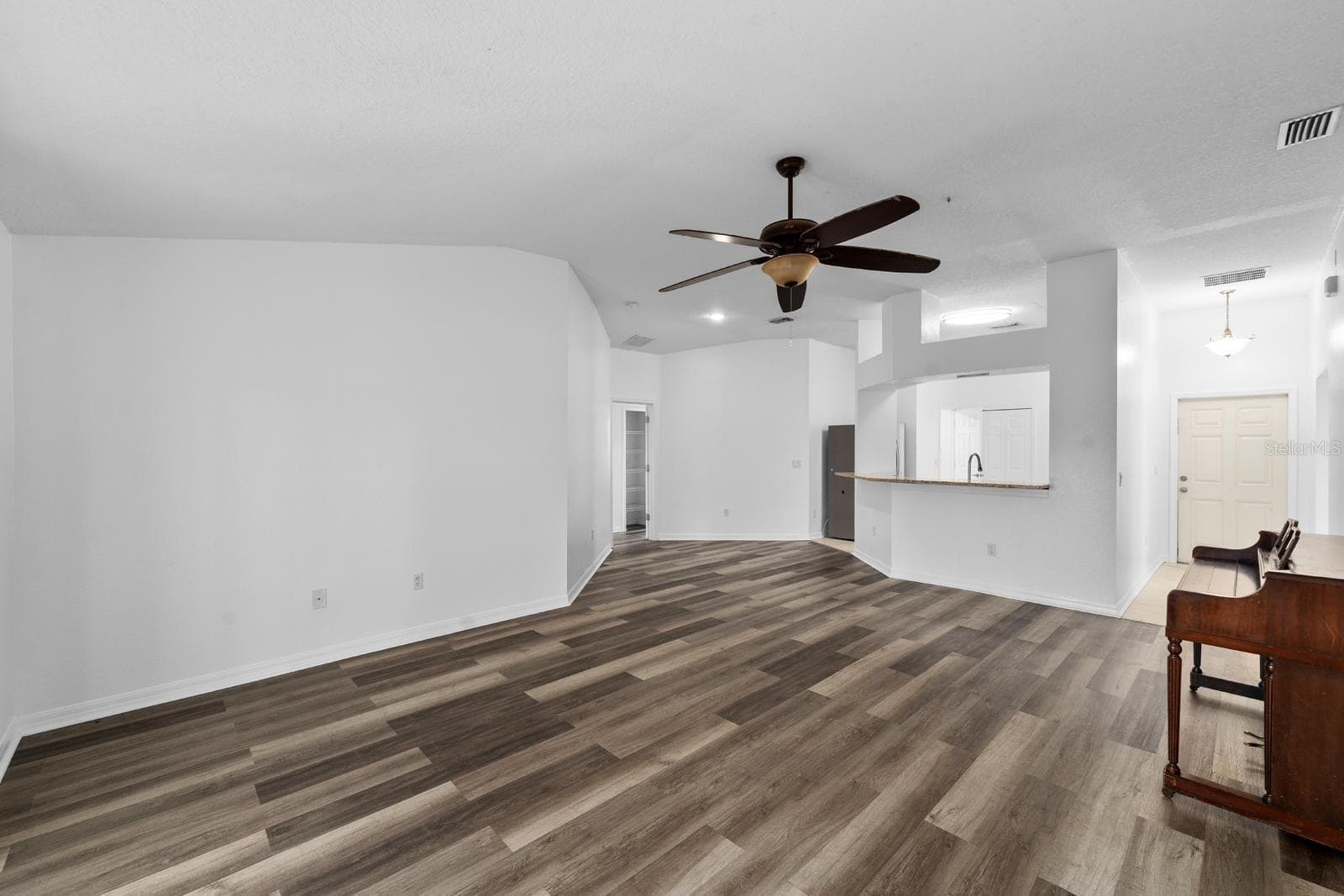 View of Front Door and Kitchen from Living Room - 3609 TRAPNELL GROVE LOOP, PLANT CITY