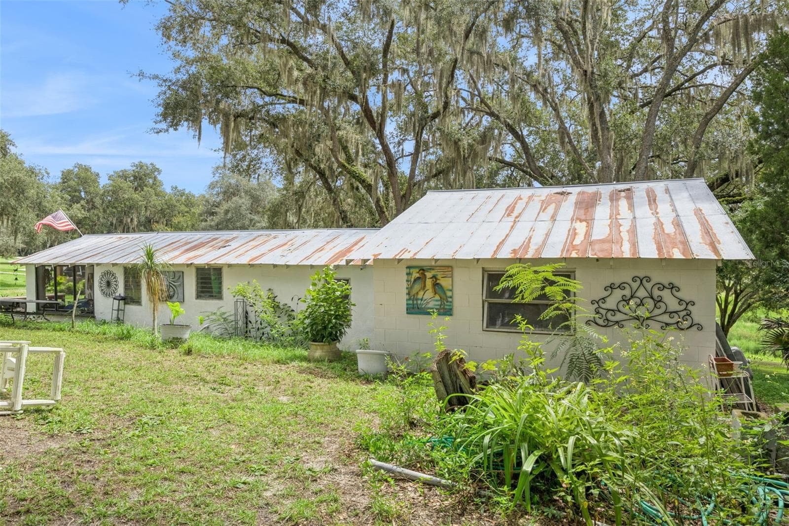 Additional outdoor workspace and storage, perfect for hobbies, projects, or a private studio. Used to be a home and can be converted back. - 1476 SPRING LAKE RD, FRUITLAND PARK