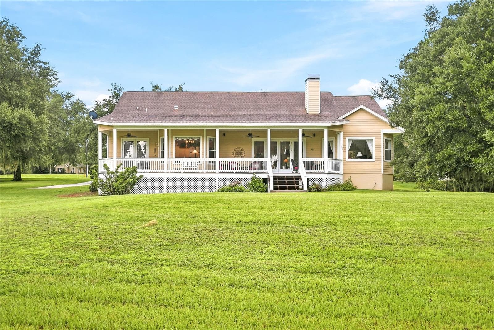 Back of house w/ Porch - 18350 HANCOCK BLUFF RD, DADE CITY