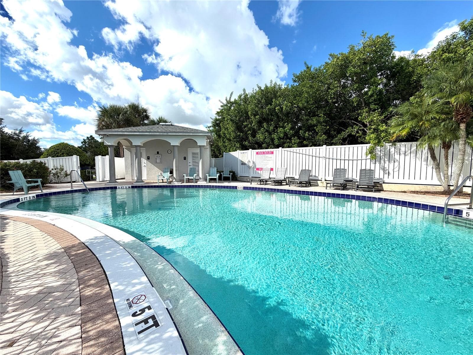 Community pool and spa - across the street from this property. - 1008 PASEO DEL RIO NE, ST PETERSBURG
