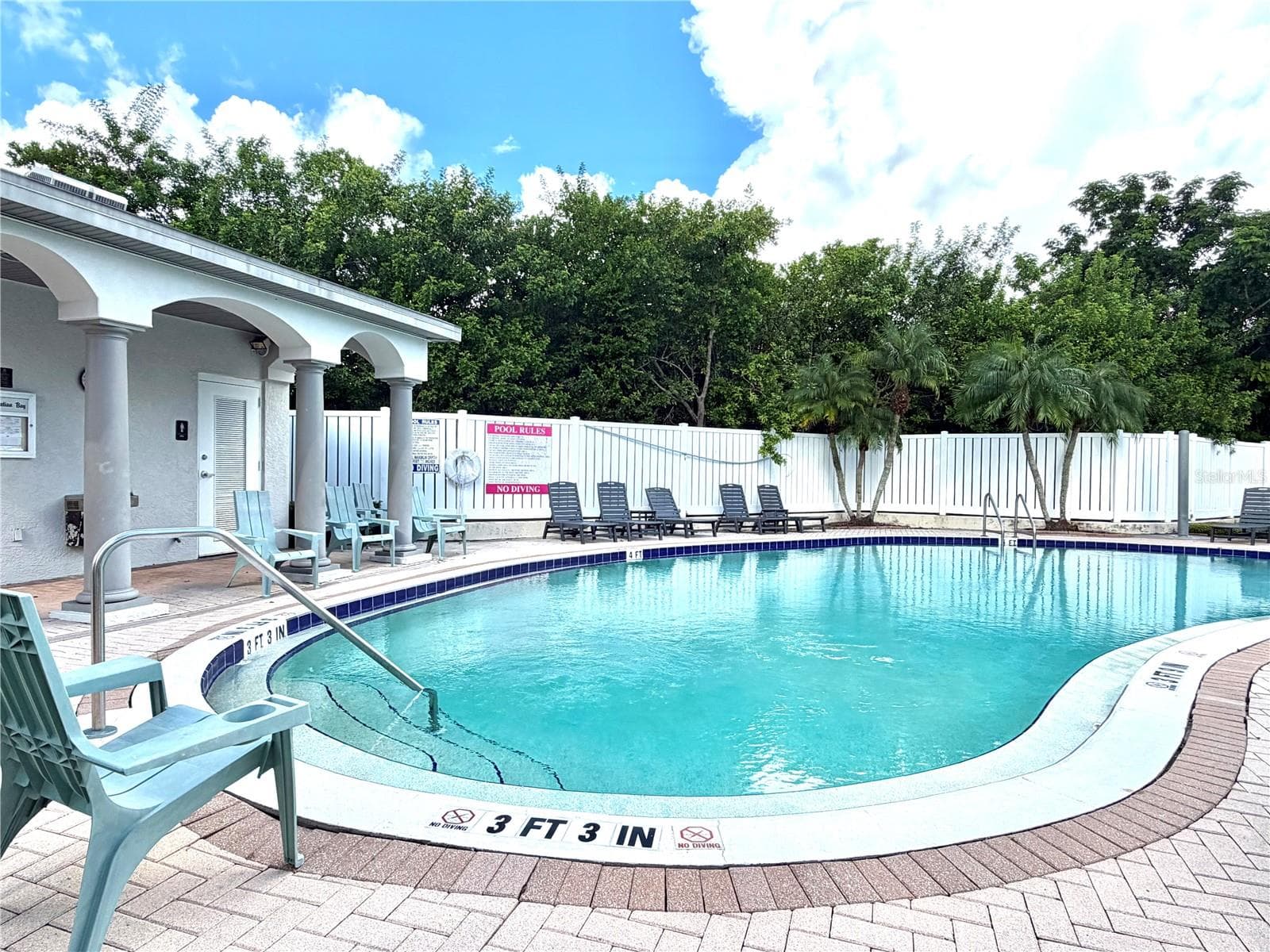 Community pool located across the street. - 1008 PASEO DEL RIO NE, ST PETERSBURG