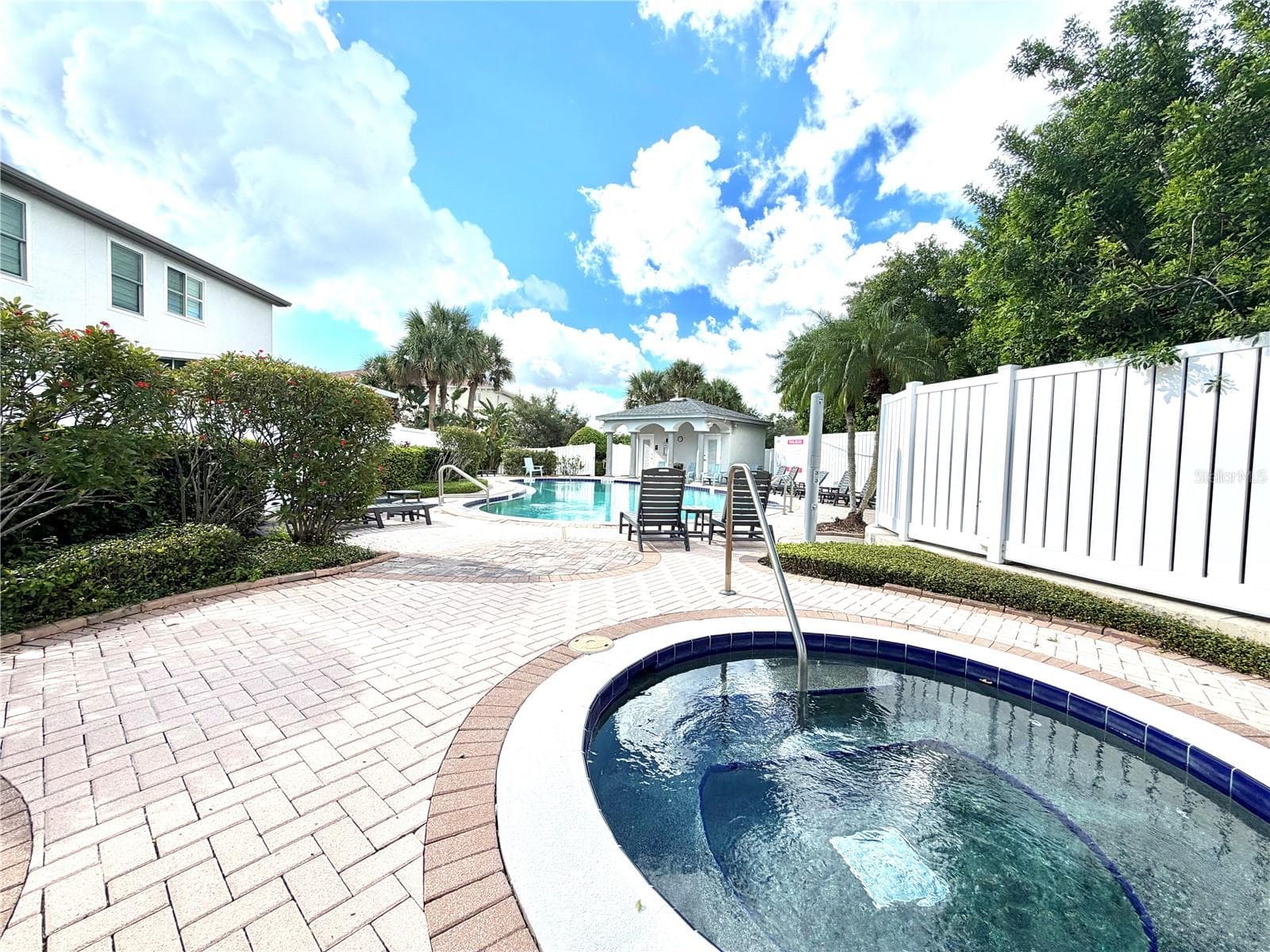 Community spa and pool area - across the street from this property. - 1008 PASEO DEL RIO NE, ST PETERSBURG