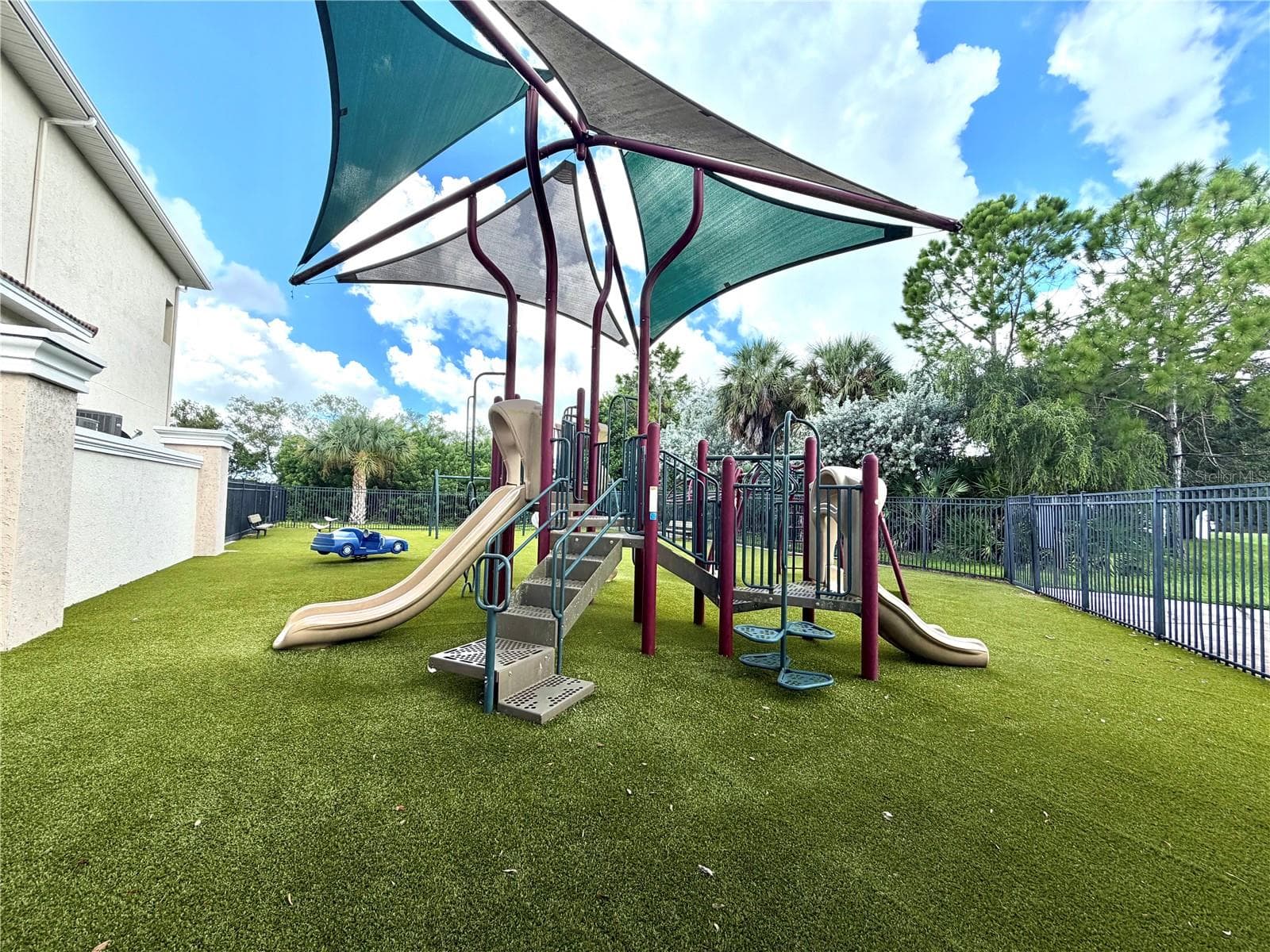 Fenced community playground. - 1008 PASEO DEL RIO NE, ST PETERSBURG