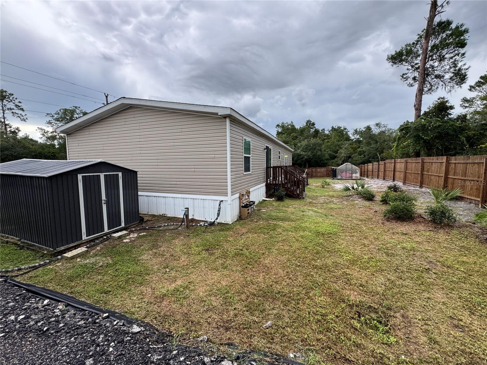 Large double door storage shed and private back yard. - 27590 COUNTY ROAD 42, PAISLEY