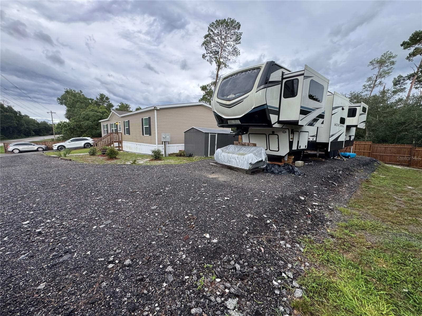 Large compacted pad can accomidate an RV, Boat, Trailer and has a 50 Amp dedicated connection for RV power - 27590 COUNTY ROAD 42, PAISLEY