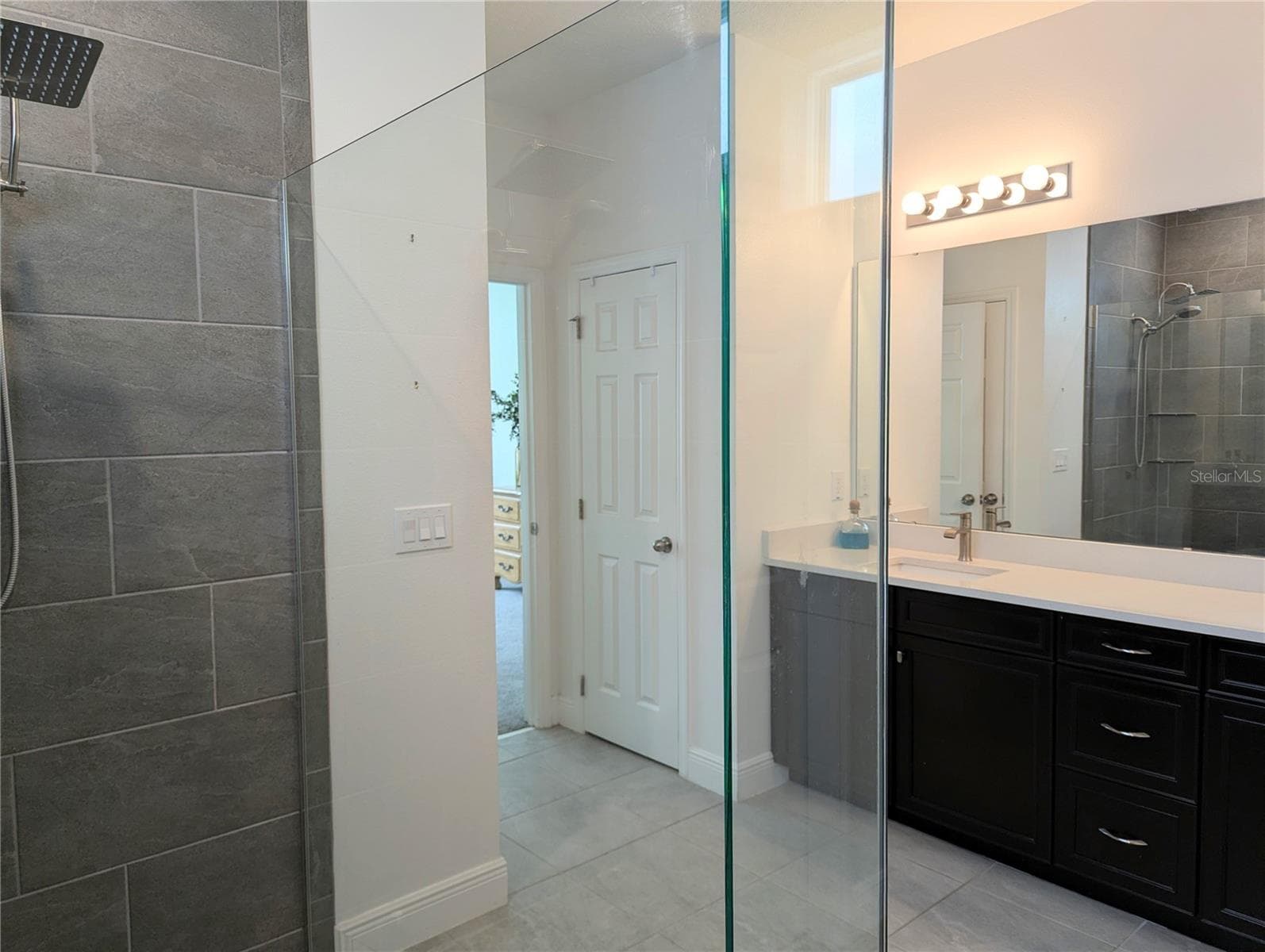 Huge walk in shower with river rock and a rain shower head. - 2333 FARNHAM DR, OCOEE