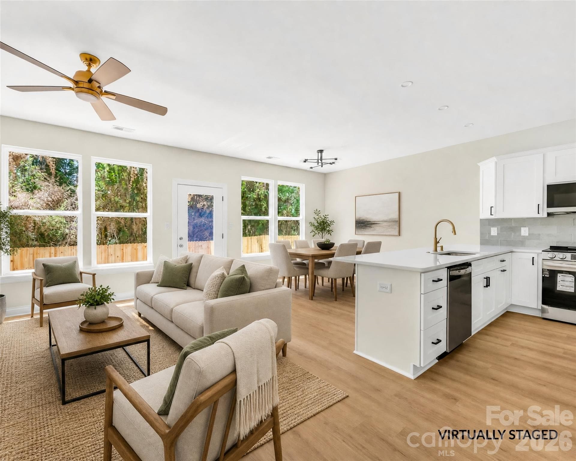 Virtually staged living and dining area on the open main level of a new construction Charlotte duet near NoDa - 1940 Purser Drive, Charlotte