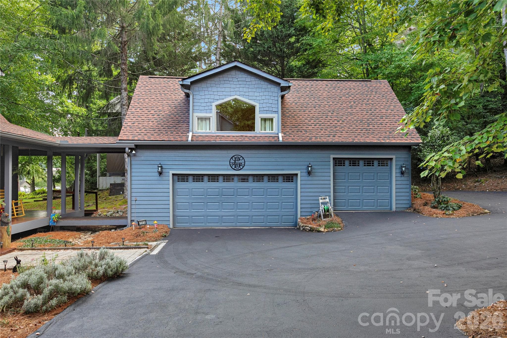 In addition to the two car garage there is an additional garage for your golf cart and/or outside toys like kayaks, canoes, etc. - 111 Kanunu Court, Brevard
