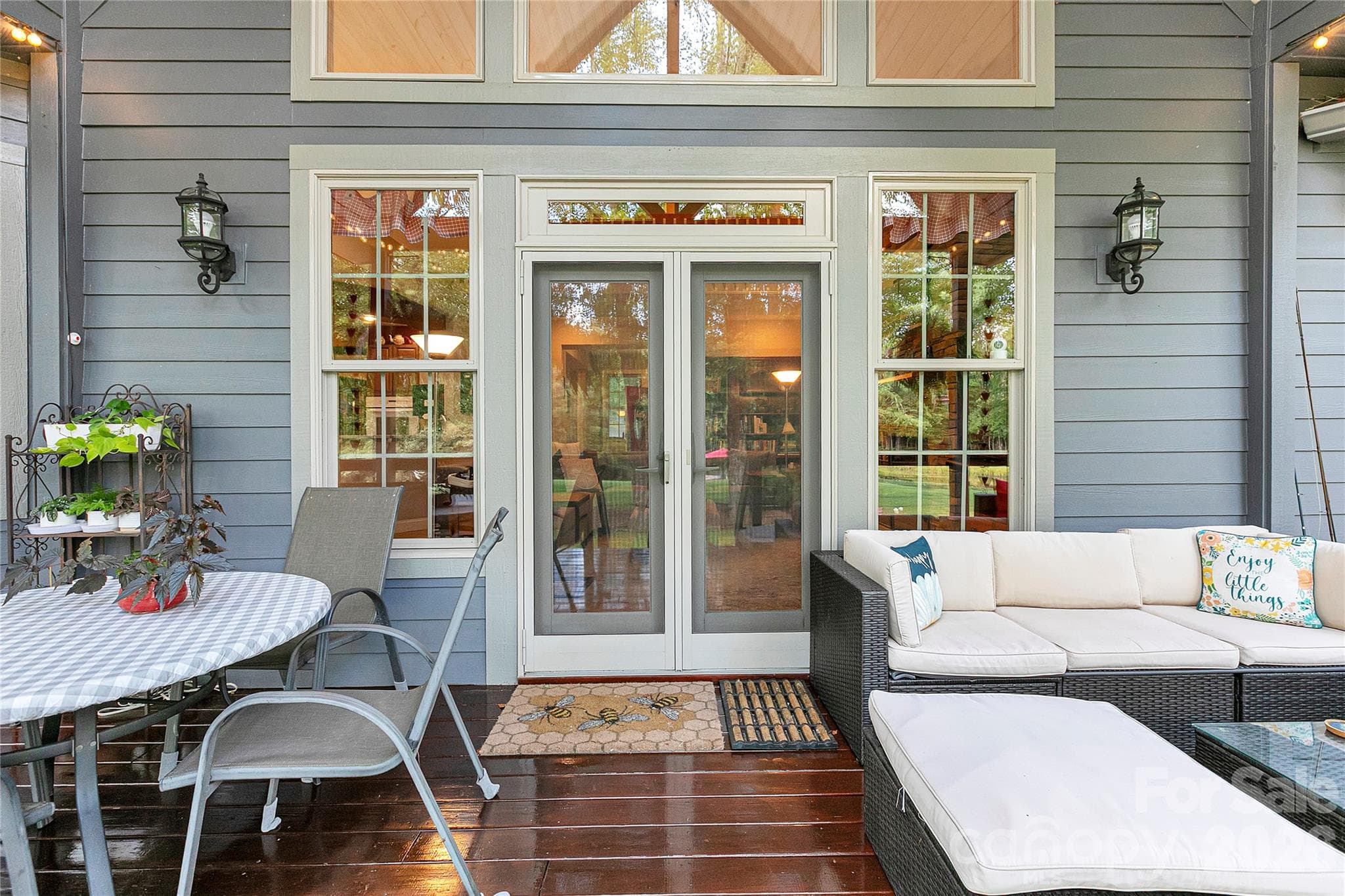 The French Doors first brings you out to the Covered Deck which will become your favorite hang out spot . A fabulous spot to entertain guests as well. - 111 Kanunu Court, Brevard