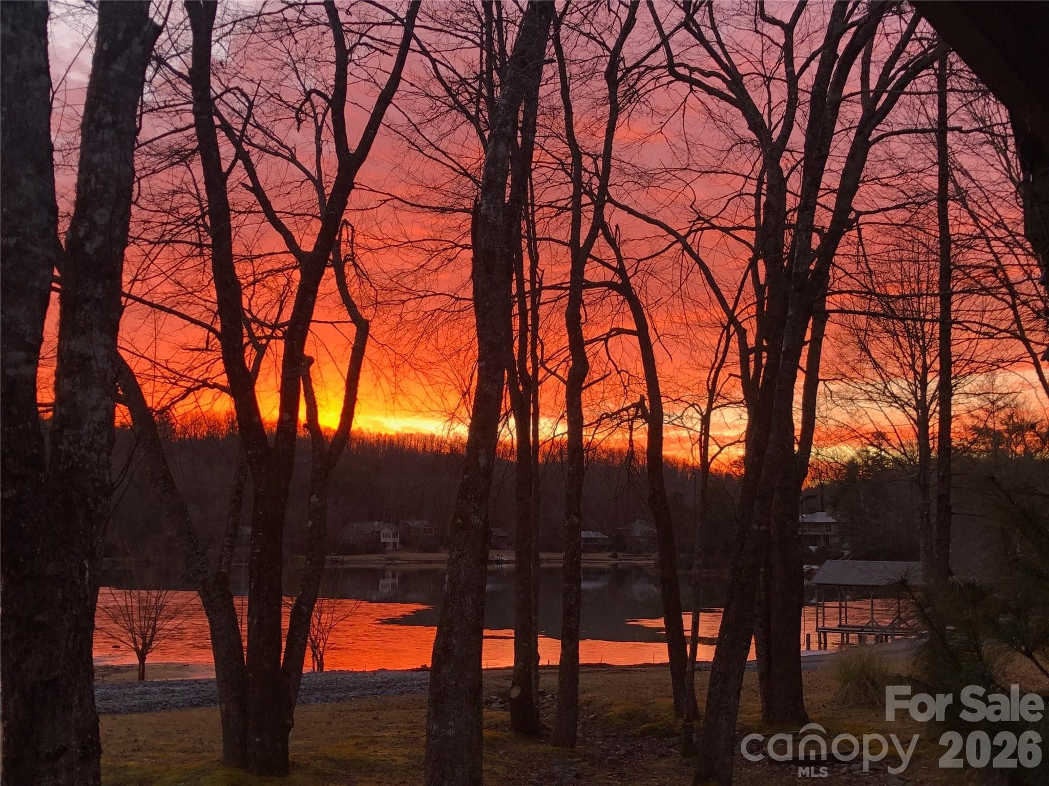 Photo taken by the owner at sunrise over the lake. - 111 Kanunu Court, Brevard