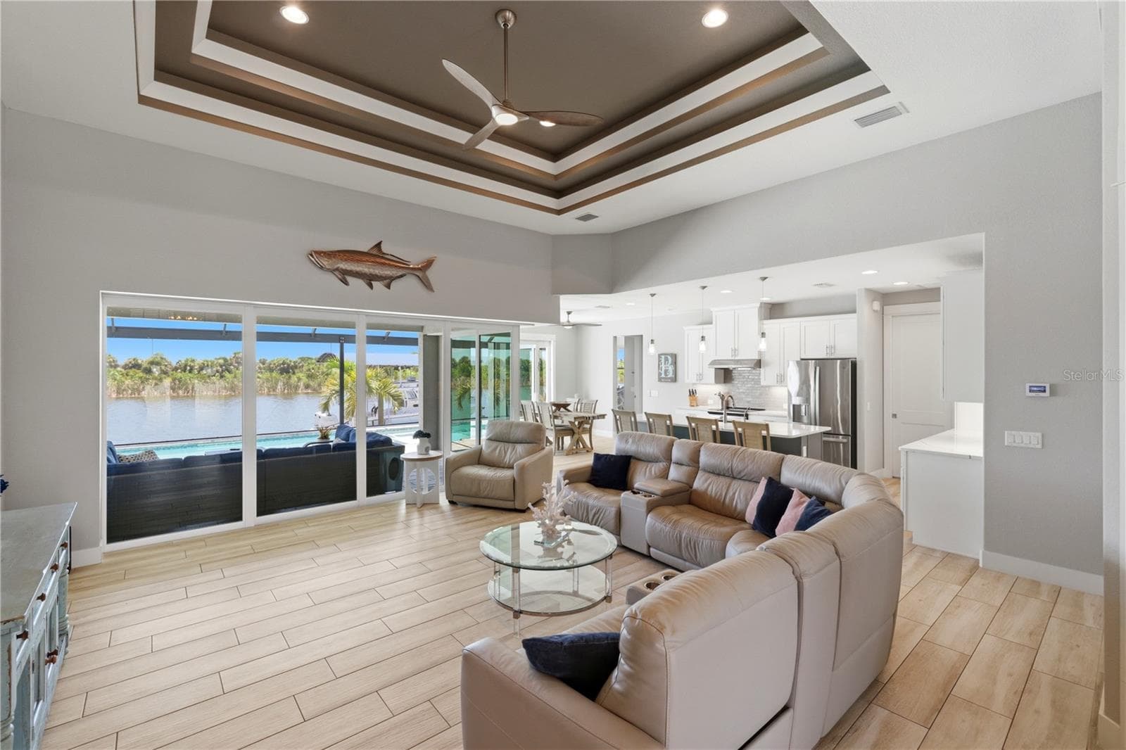 Open Greatroom with access to lanai and pool - 10628 MCALESTER CIR, PORT CHARLOTTE
