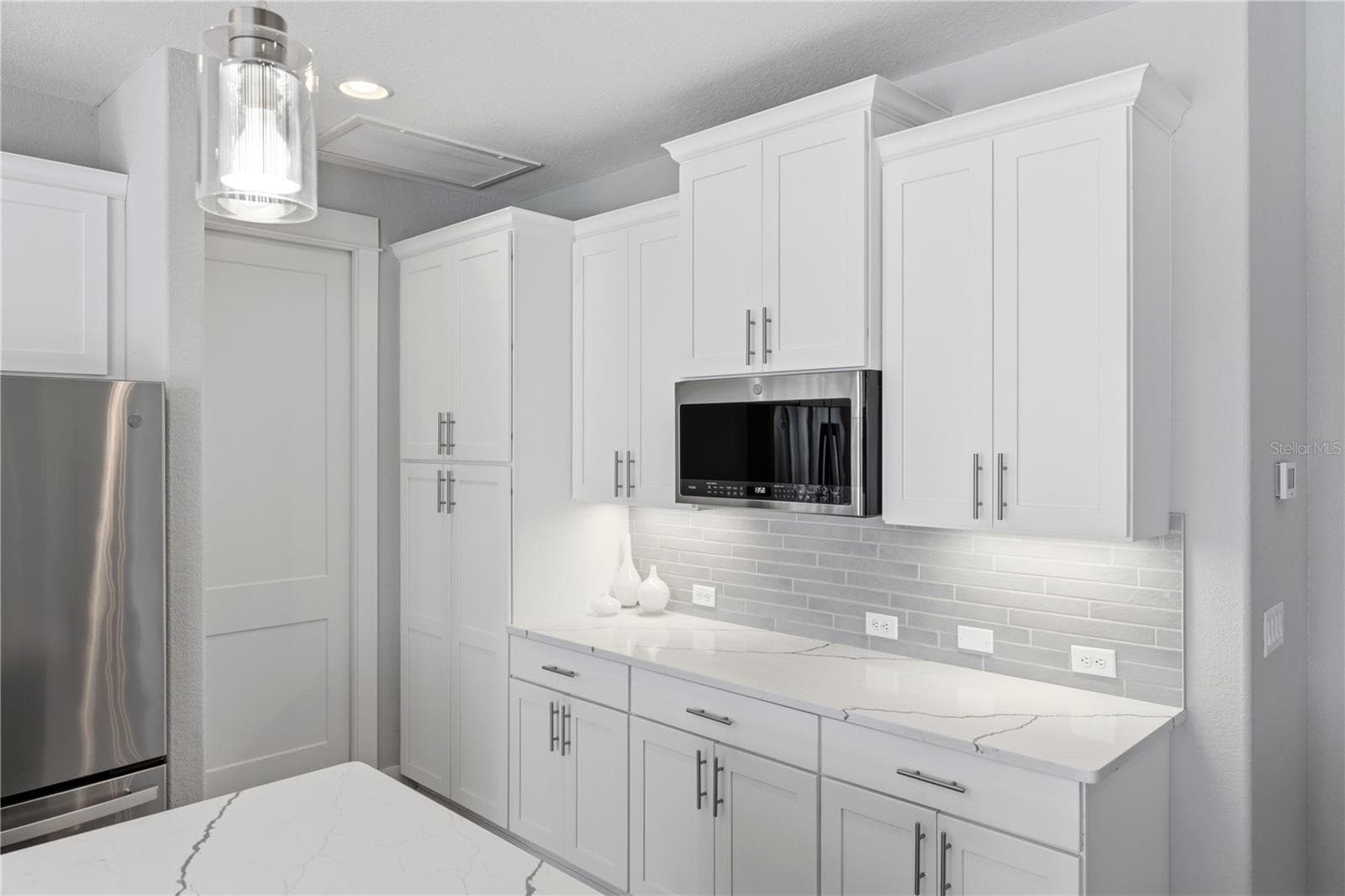 Side buffet with pantry and more cabinets - 10628 MCALESTER CIR, PORT CHARLOTTE