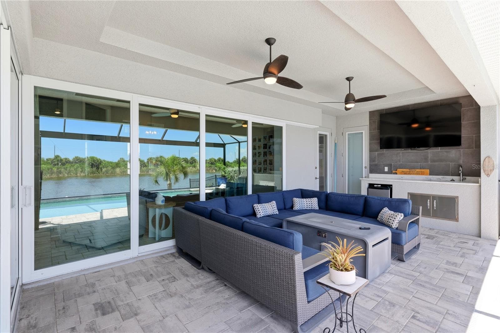 Outdoor covered pool deck with outdoor kitchen - 10628 MCALESTER CIR, PORT CHARLOTTE