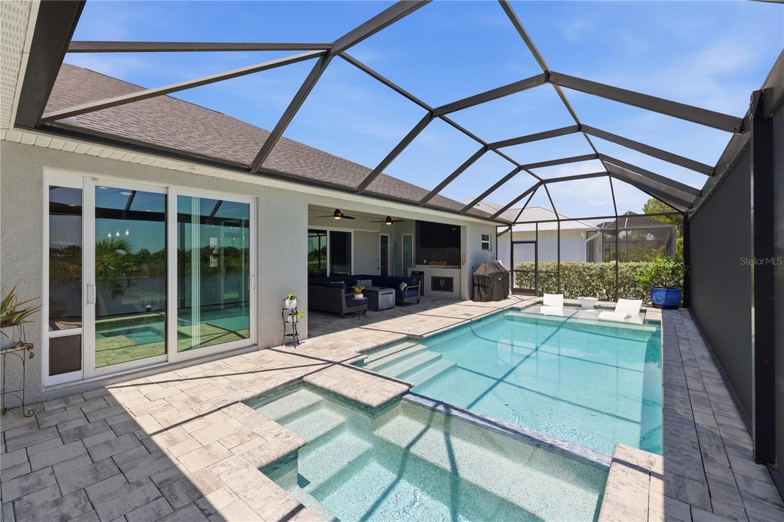 Shows the whole pool from the extra space on lanai - 10628 MCALESTER CIR, PORT CHARLOTTE