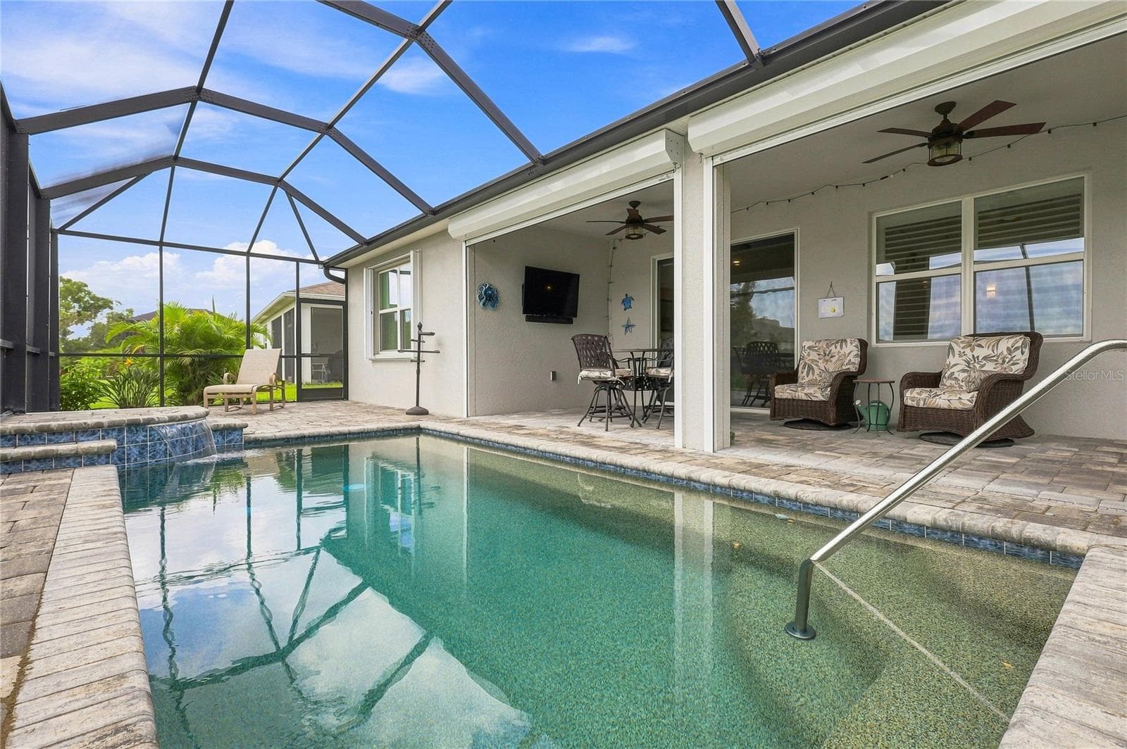 Notice the remote operated hurricane shutters which enclose the lanai.  Such a convenient feature! - 5711 OAK BRIDGE CT, BRADENTON