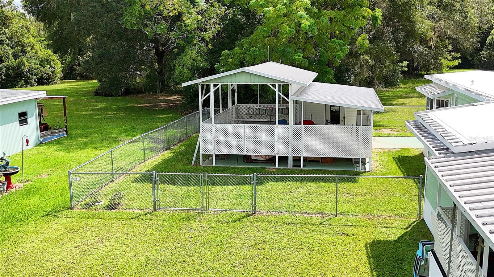 with fenced yard and RV port... - 417 NE 64TH AVE, OCALA
