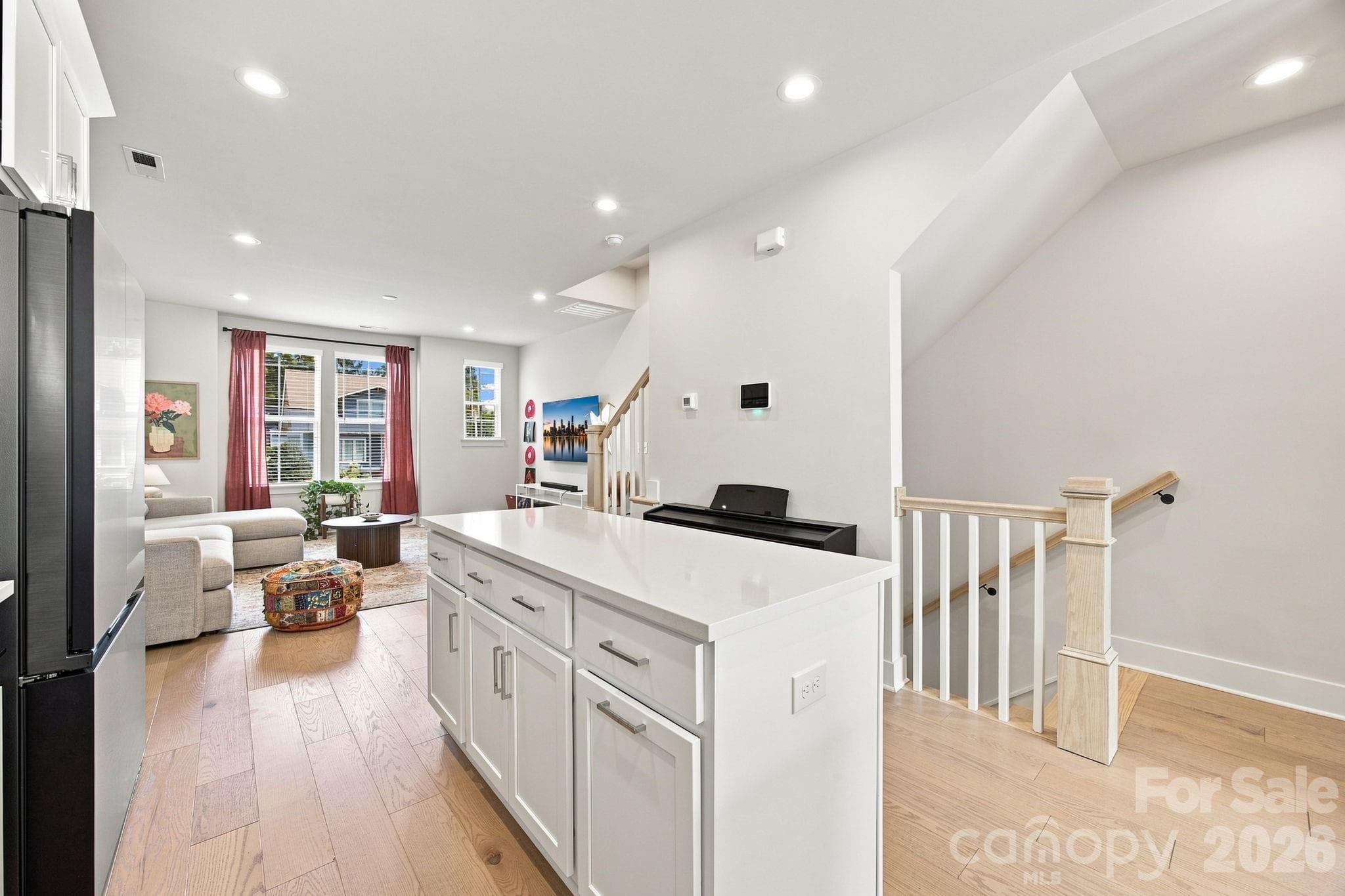 Inviting kitchen with quartz counters and craftsman cabinetry - 2303 Rozzelles Ferry Road, Charlotte