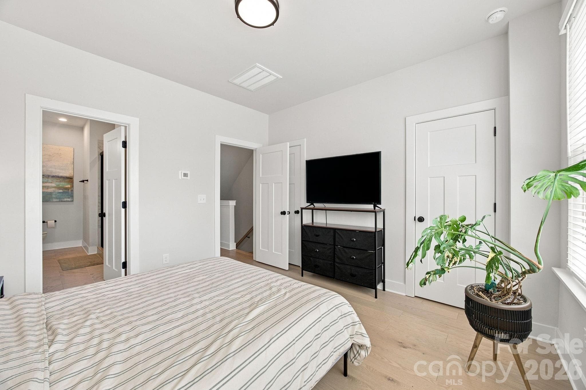 Primary bedroom with dual-access walk-in closet - 2303 Rozzelles Ferry Road, Charlotte